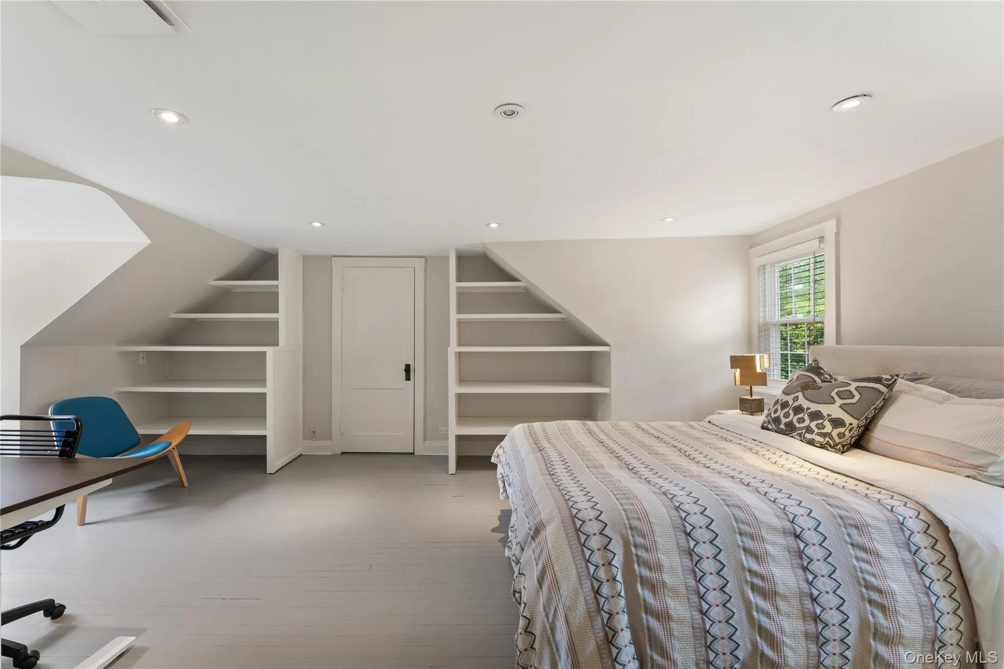 Third Level Bedroom with large closet and built-in shelves. Third Level Bedroom with large closet and built-in shelves.