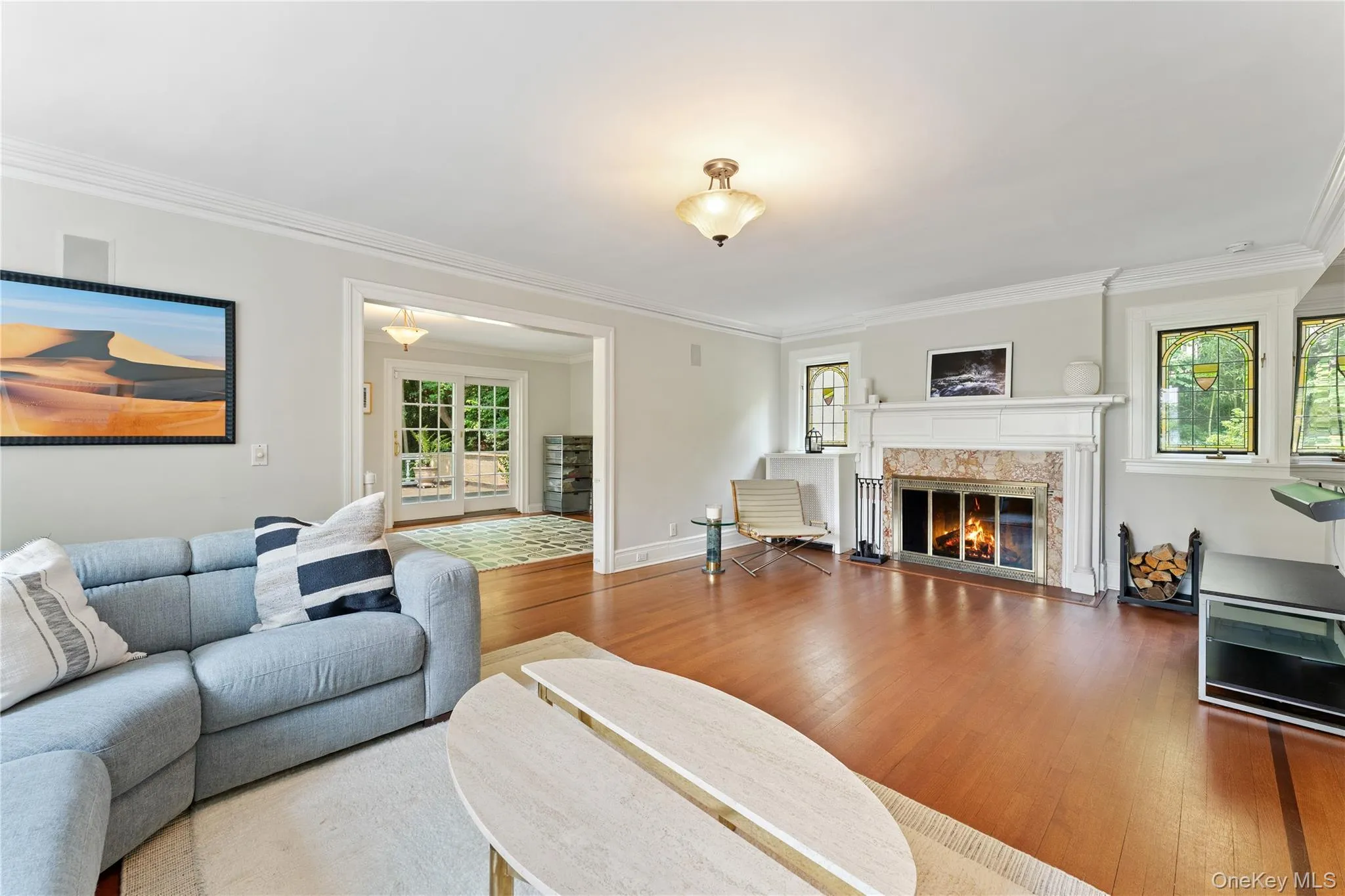 Living Room view featuring wood-burning fireplace and hardwood floors. Living Room view featuring wood-burning fireplace and hardwood floors.