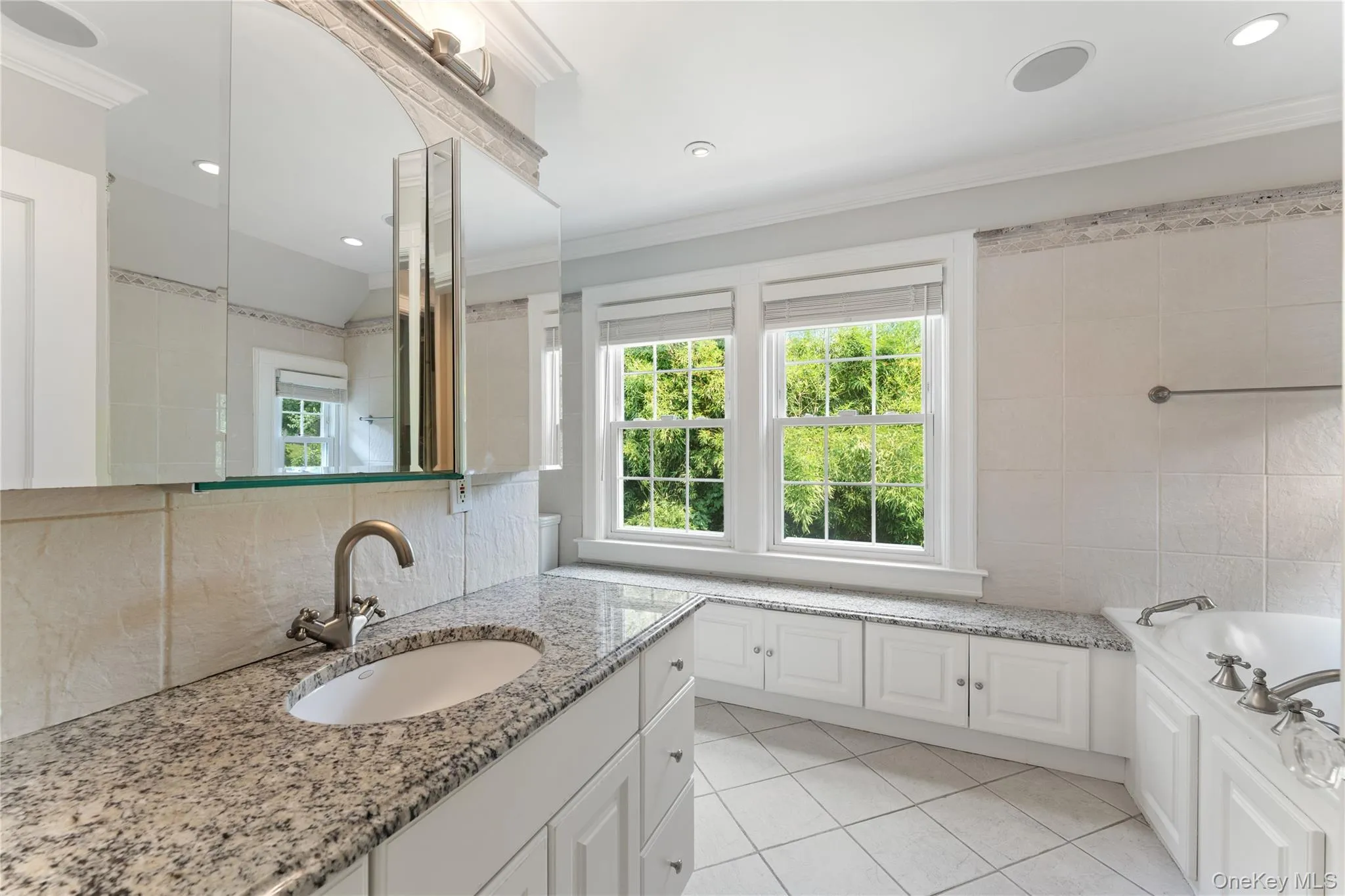 Primary Bathroom with built-in cabinetry and soaking tub. Primary Bathroom with built-in cabinetry and soaking tub.
