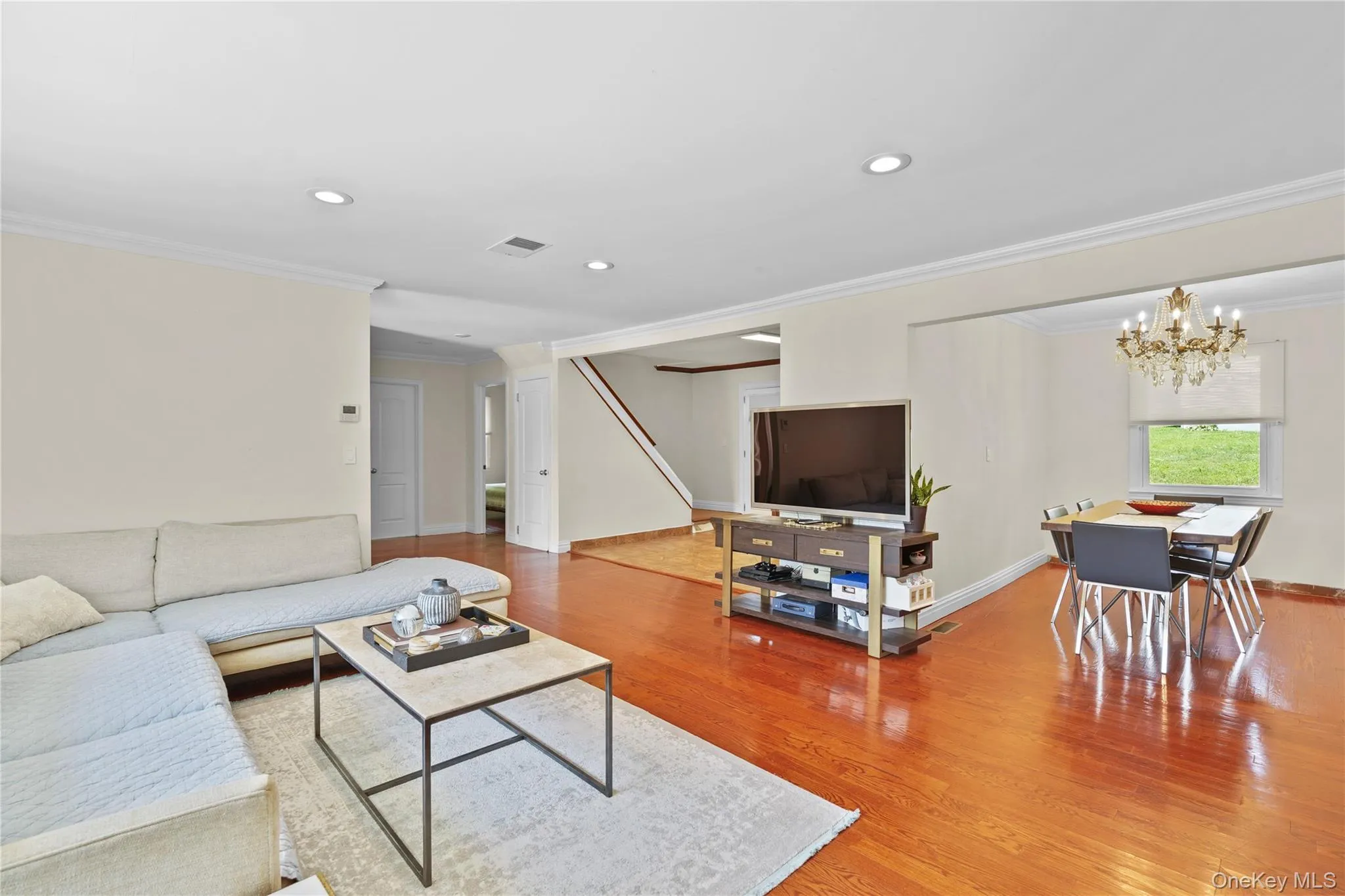 Open-concept living space with a seamless transition to the dining area Open-concept living space with a seamless transition to the dining area