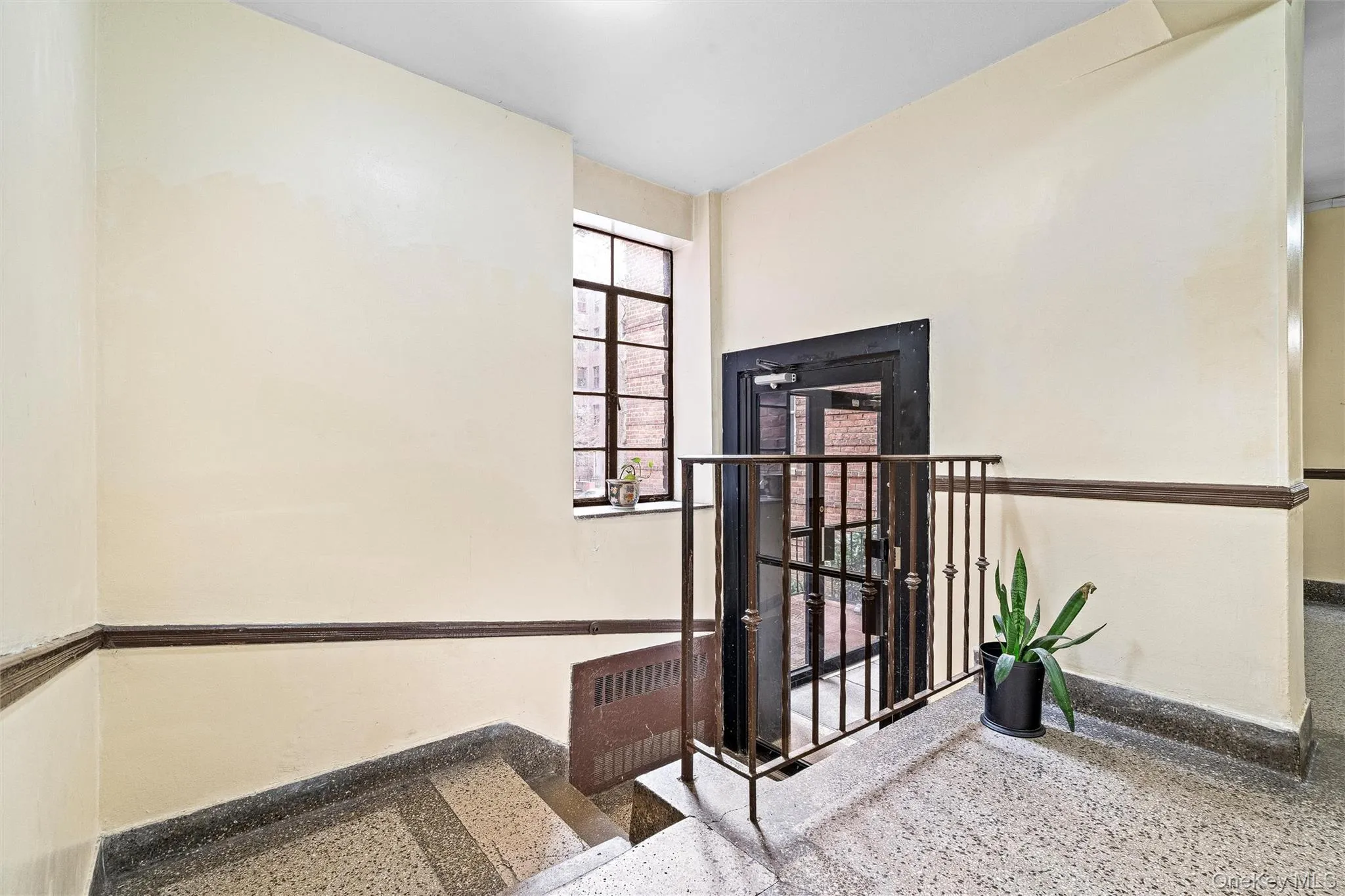 Stairway featuring speckled floor Stairway featuring speckled floor
