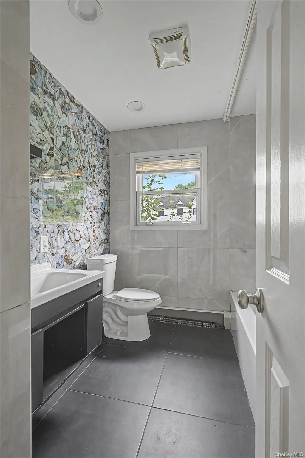 Modern bathroom with stylish finishes and a sleek vanity. Modern bathroom with stylish finishes and a sleek vanity.