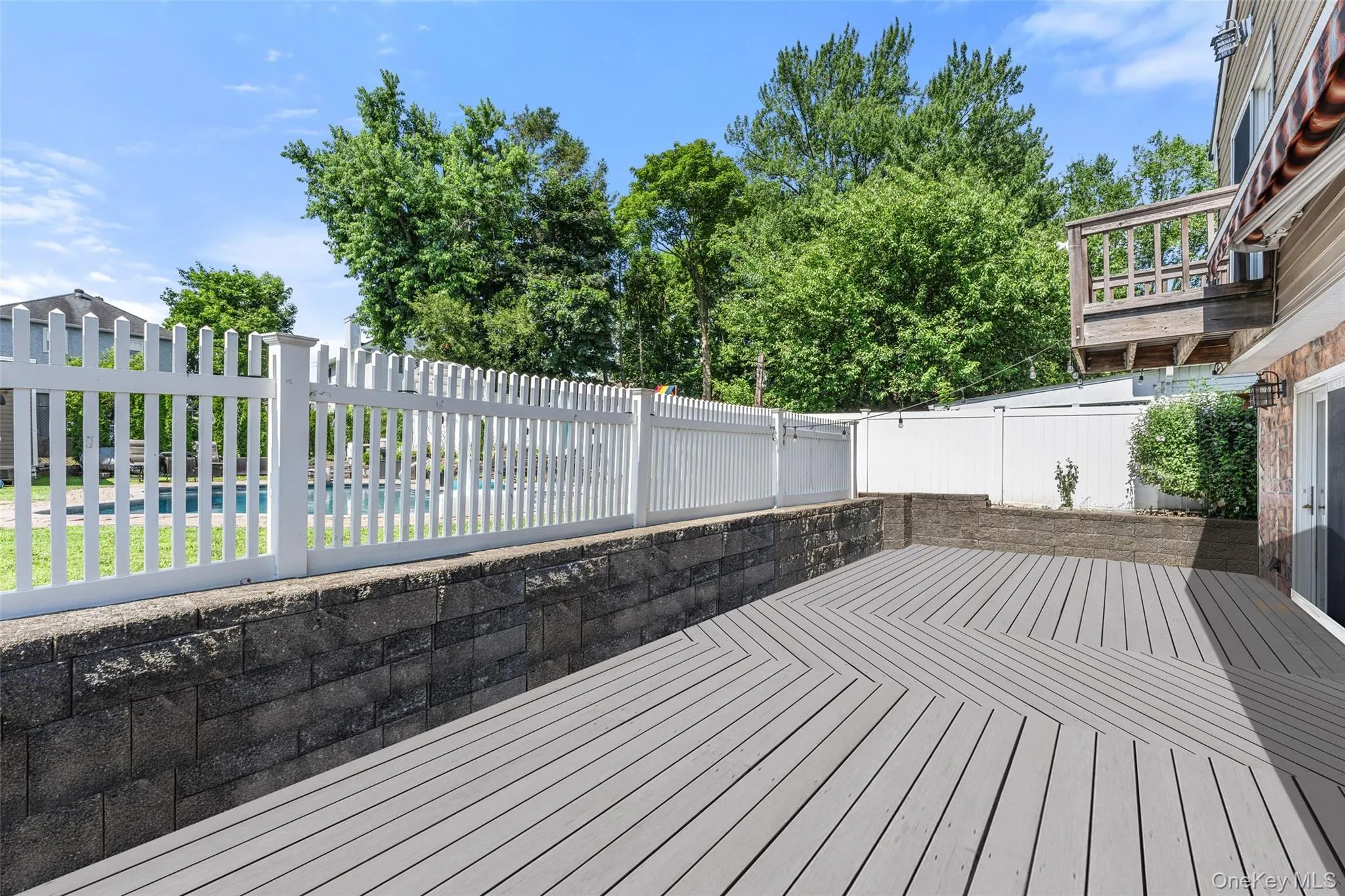 Expansive deck with access to the family room and the dine-in kitchen. Expansive deck with access to the family room and the dine-in kitchen.