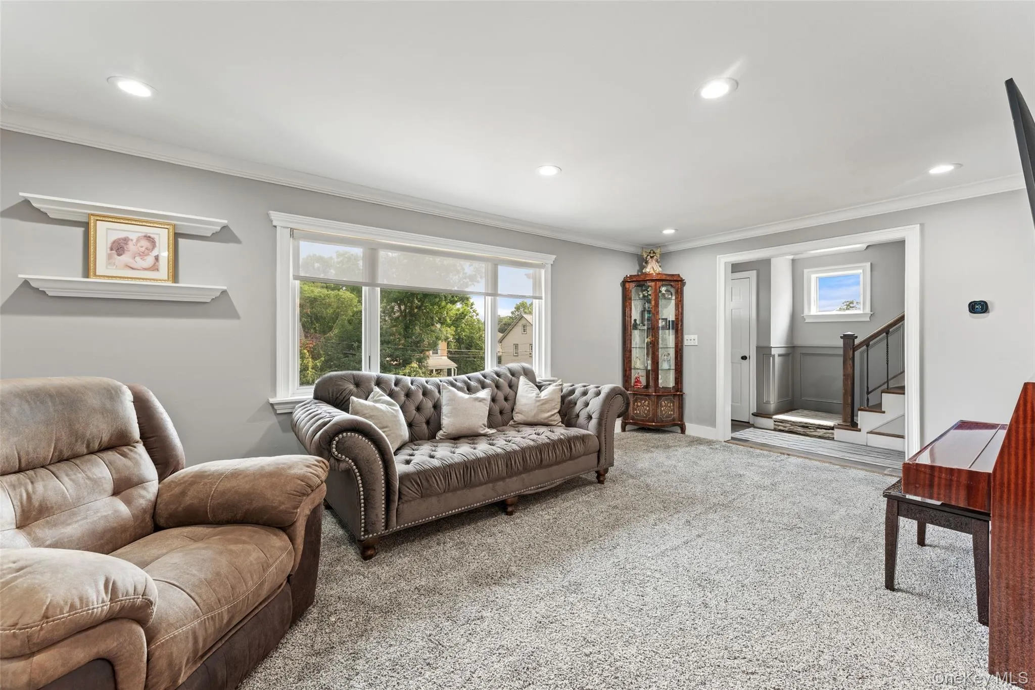 Freshly painted Living room with picture window and recessed lighting. Freshly painted Living room with picture window and recessed lighting.