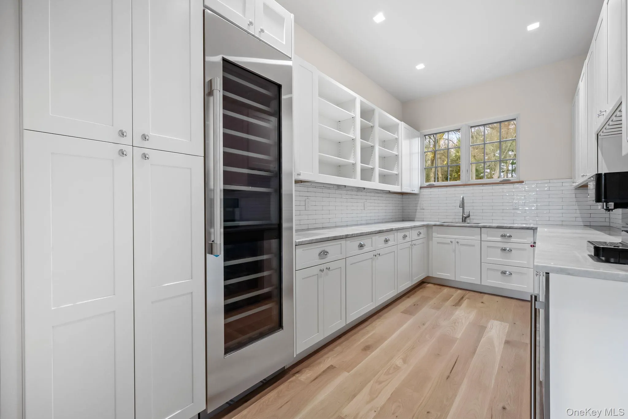 Butler’s Pantry with wine refrigerator, wet bar and expansive cabinetry Butler’s Pantry with wine refrigerator, wet bar and expansive cabinetry