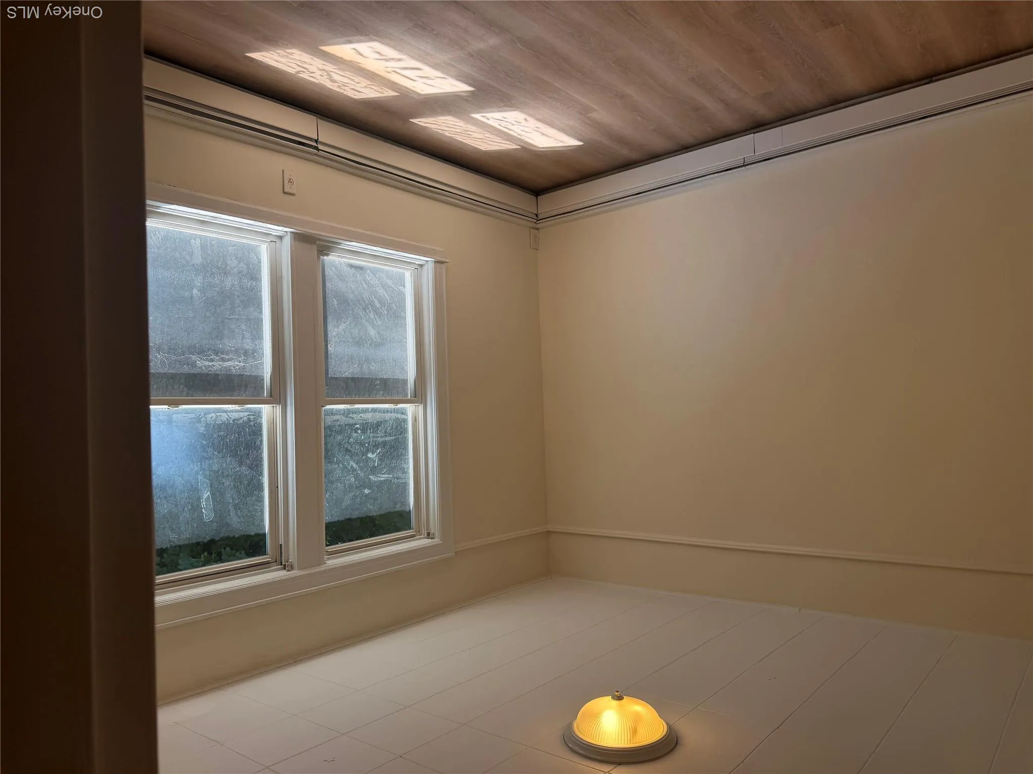 Bedroom with windows showing outside Bedroom with windows showing outside