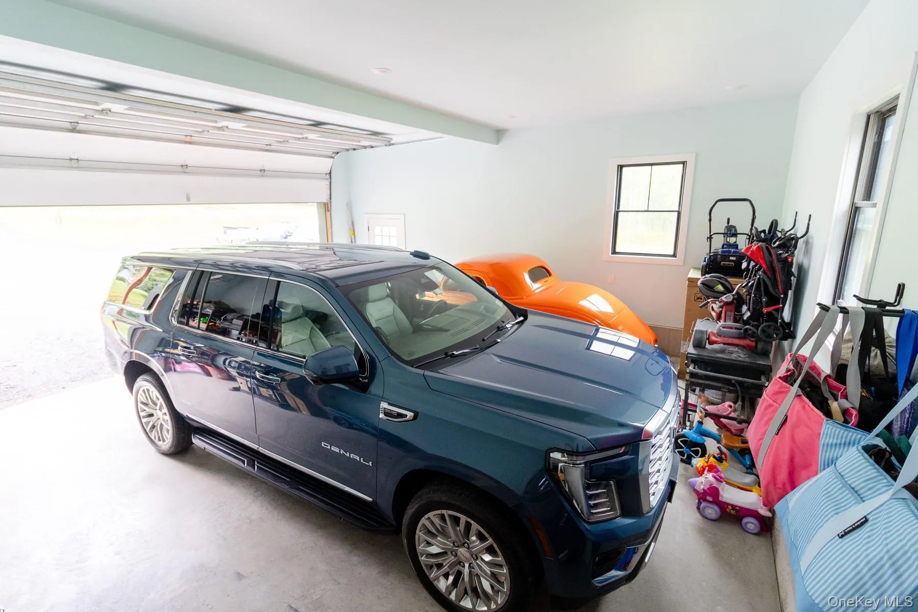 Garage with generous room for vehicles, recreational equipment, lawn care essentials, and everyday storage - all under one roof. Garage with generous room for vehicles, recreational equipment, lawn care essentials, and everyday storage - all under one roof.