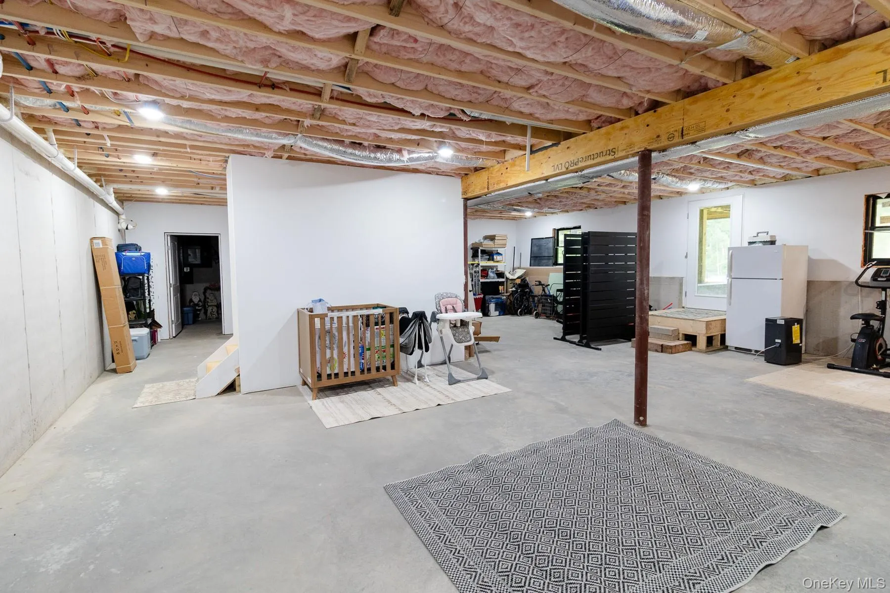 This additional view highlights the exceptional scale of the lower level, with dedicated areas for organized storage while preserving an open uncluttered feel This additional view highlights the exceptional scale of the lower level, with dedicated areas for organized storage while preserving an open uncluttered feel