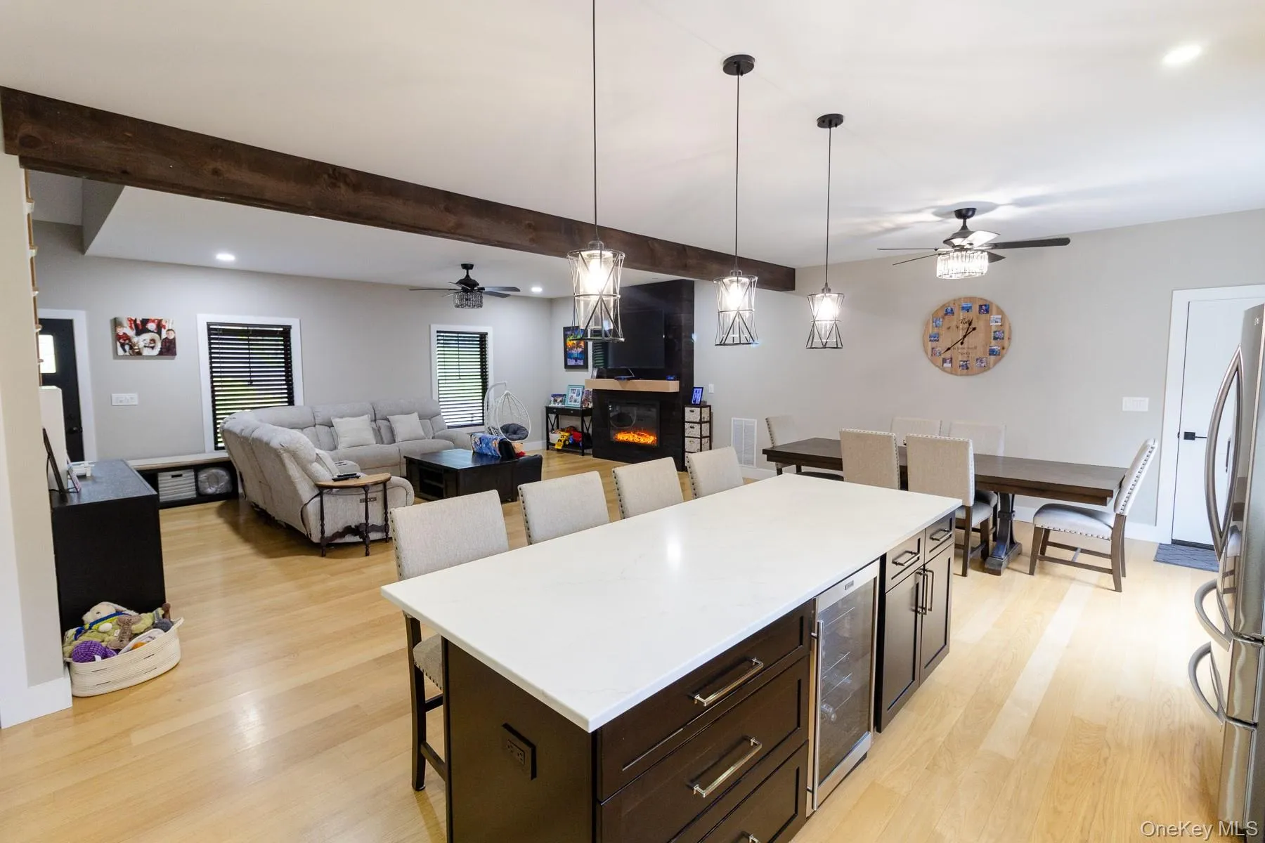 The kitchen serves as a refined visual anchor drawing the eye through a beautifully coordinated arrangement of living spaces unified by warm white oak hardwood flooring and exposed timber detail. The kitchen serves as a refined visual anchor drawing the eye through a beautifully coordinated arrangement of living spaces unified by warm white oak hardwood flooring and exposed timber detail.