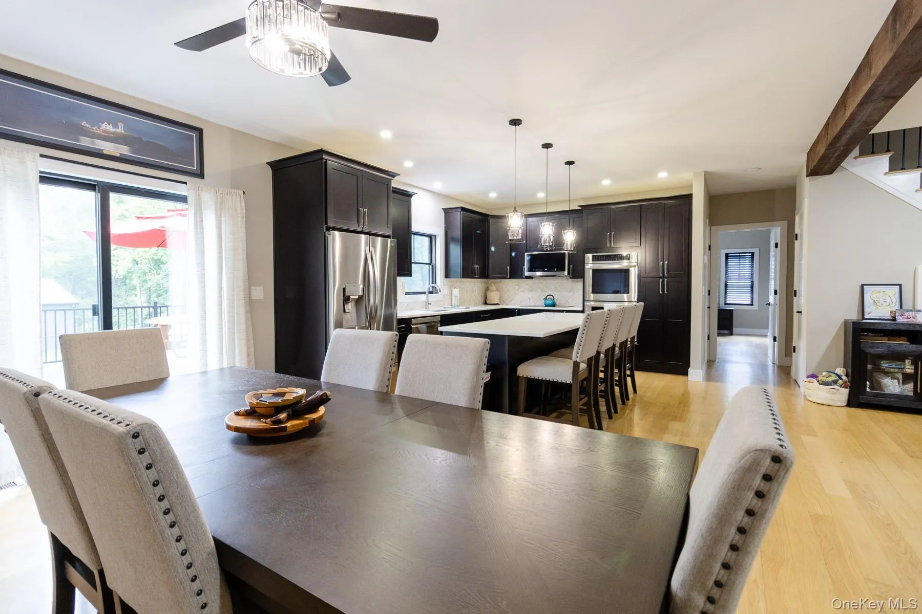 The spacious dining area is thoughtfully positioned to serve both the kitchen and adjoining living space, creating a layout designed for comfortable daily living. The spacious dining area is thoughtfully positioned to serve both the kitchen and adjoining living space, creating a layout designed for comfortable daily living.