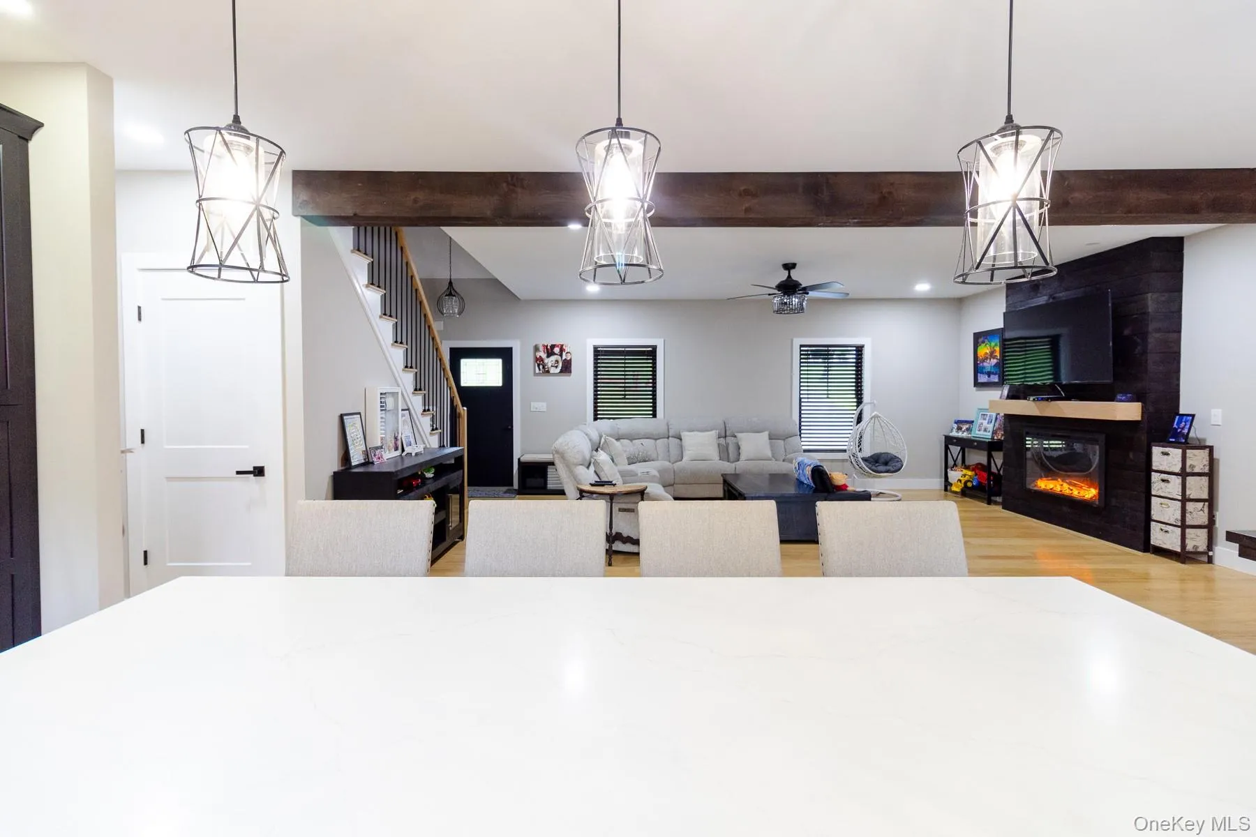 Framed by exposed timber and distinctive lighting, this perspective highlights the home's balanced scale and cohesive interior design. Framed by exposed timber and distinctive lighting, this perspective highlights the home's balanced scale and cohesive interior design.