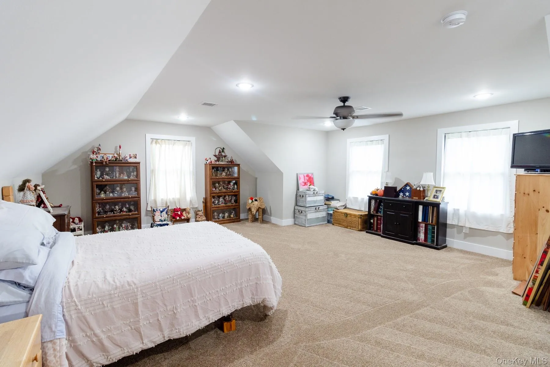 A second perspective showcases the abundant natural light and generous floor space creating a bright, inviting bedroom with exceptional flexibility. A second perspective showcases the abundant natural light and generous floor space creating a bright, inviting bedroom with exceptional flexibility.