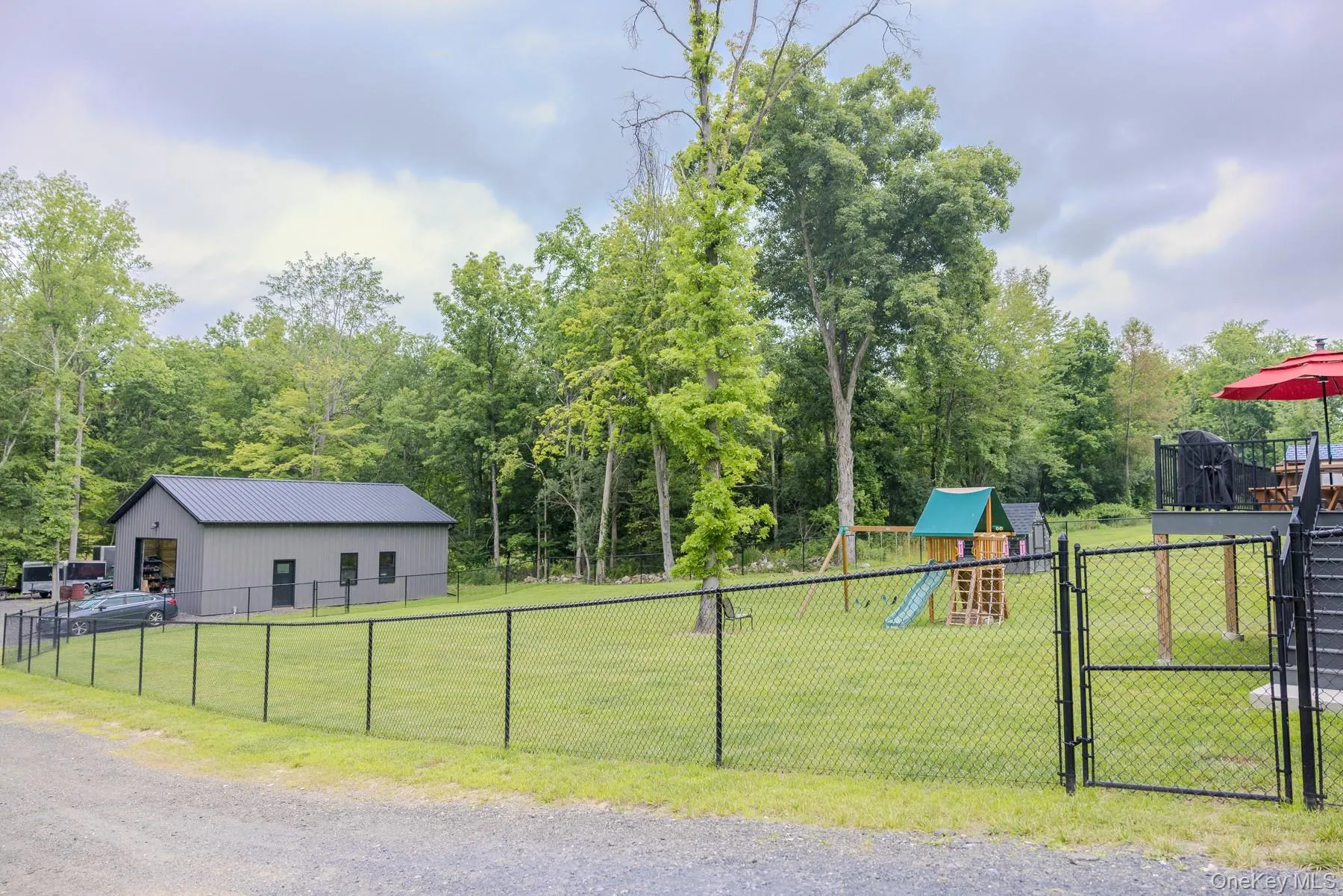 The expansive yard provides plenty of room to enjoy the outdoors while showcasing the impressive 2024 pole barn as a standout feature of the property. The expansive yard provides plenty of room to enjoy the outdoors while showcasing the impressive 2024 pole barn as a standout feature of the property.