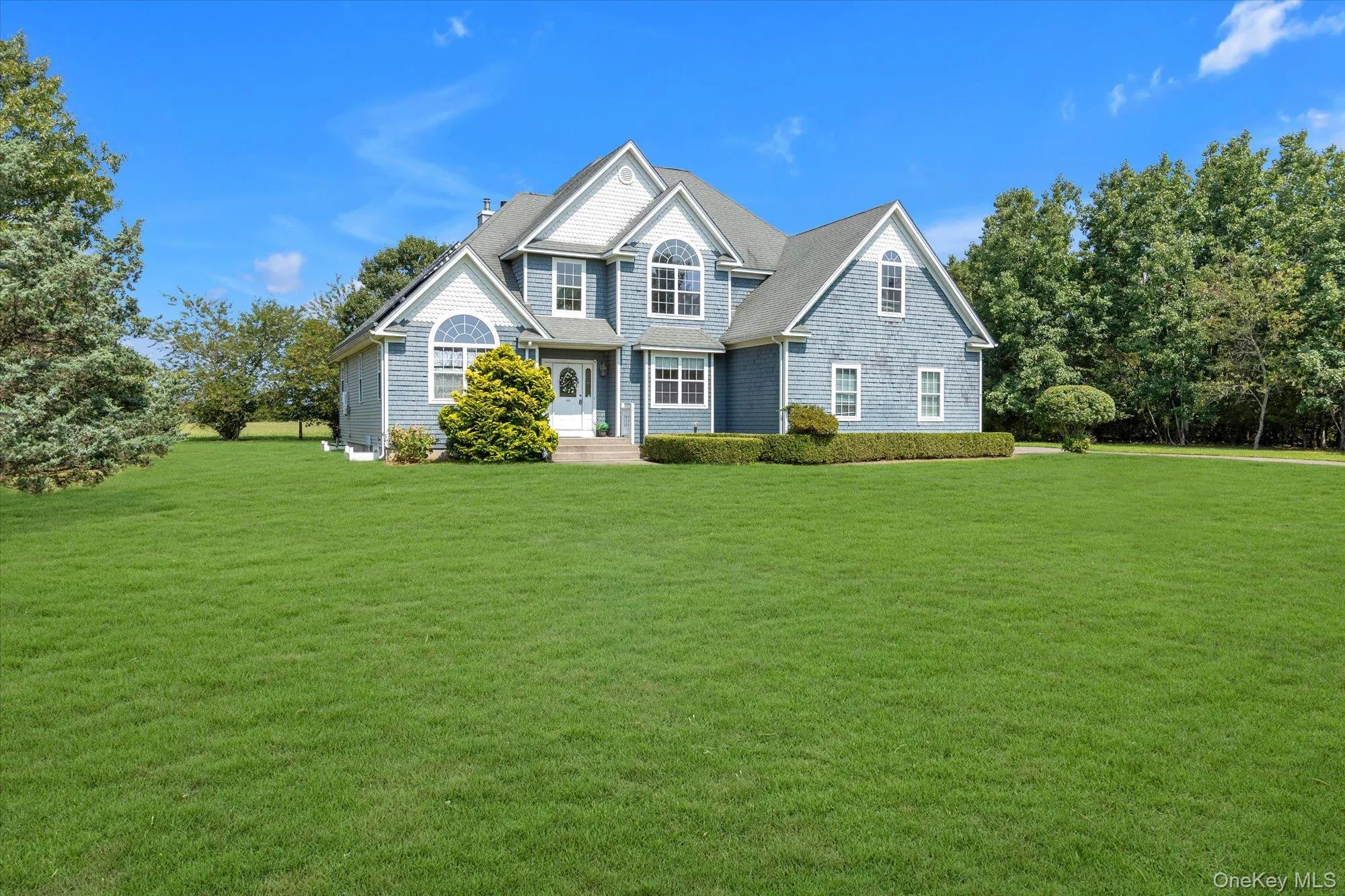 Siding exterior with multiple gables and dormer windows Siding exterior with multiple gables and dormer windows