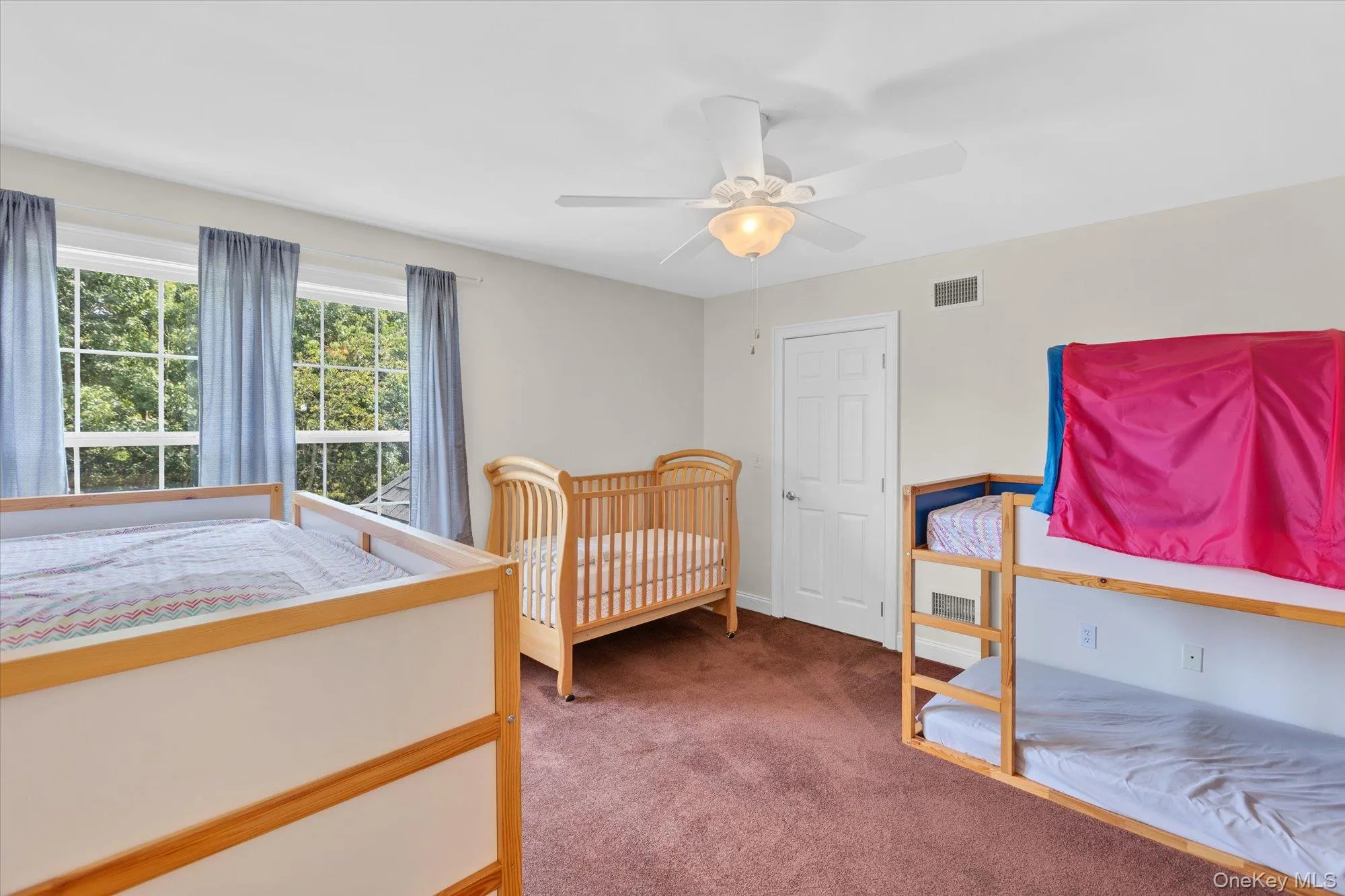 Neutral wall paint, ceiling fan with integrated lighting, brown carpet flooring, and white trim Neutral wall paint, ceiling fan with integrated lighting, brown carpet flooring, and white trim