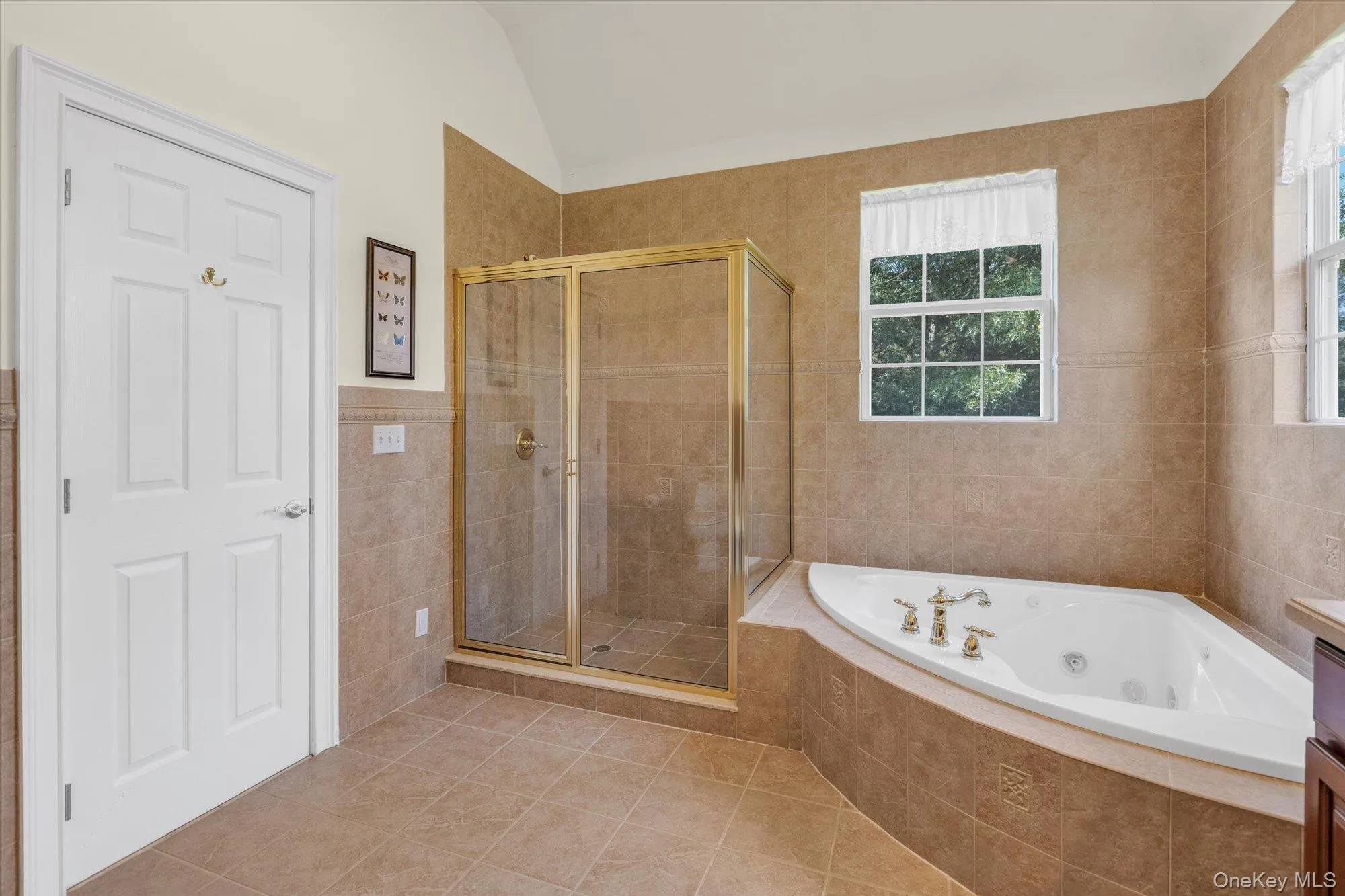 Tile flooring with a coordinating tile shower surround and tub deck Tile flooring with a coordinating tile shower surround and tub deck