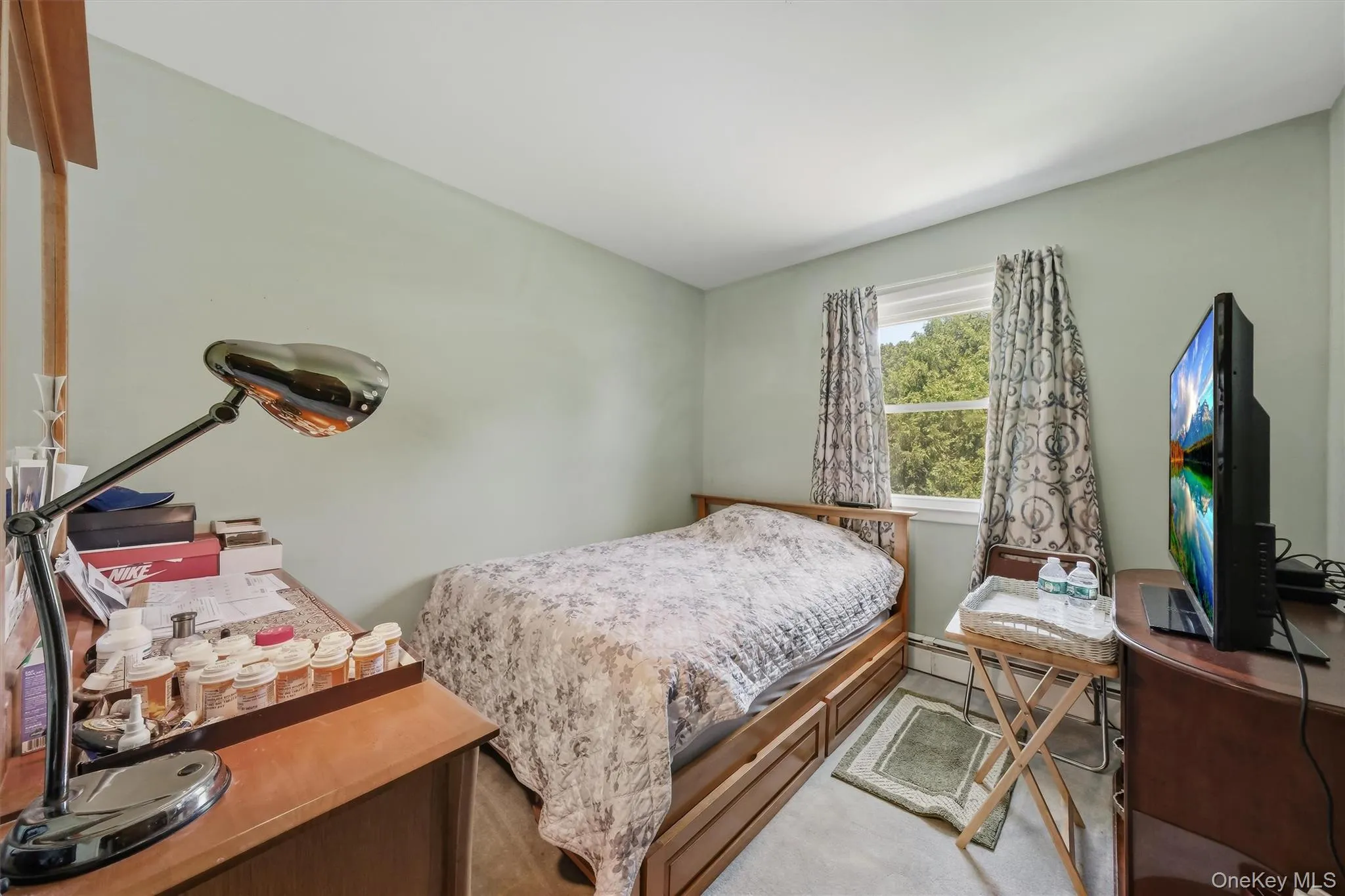 Generous sized primary with hardwood flooring underneath carpeting Generous sized primary with hardwood flooring underneath carpeting