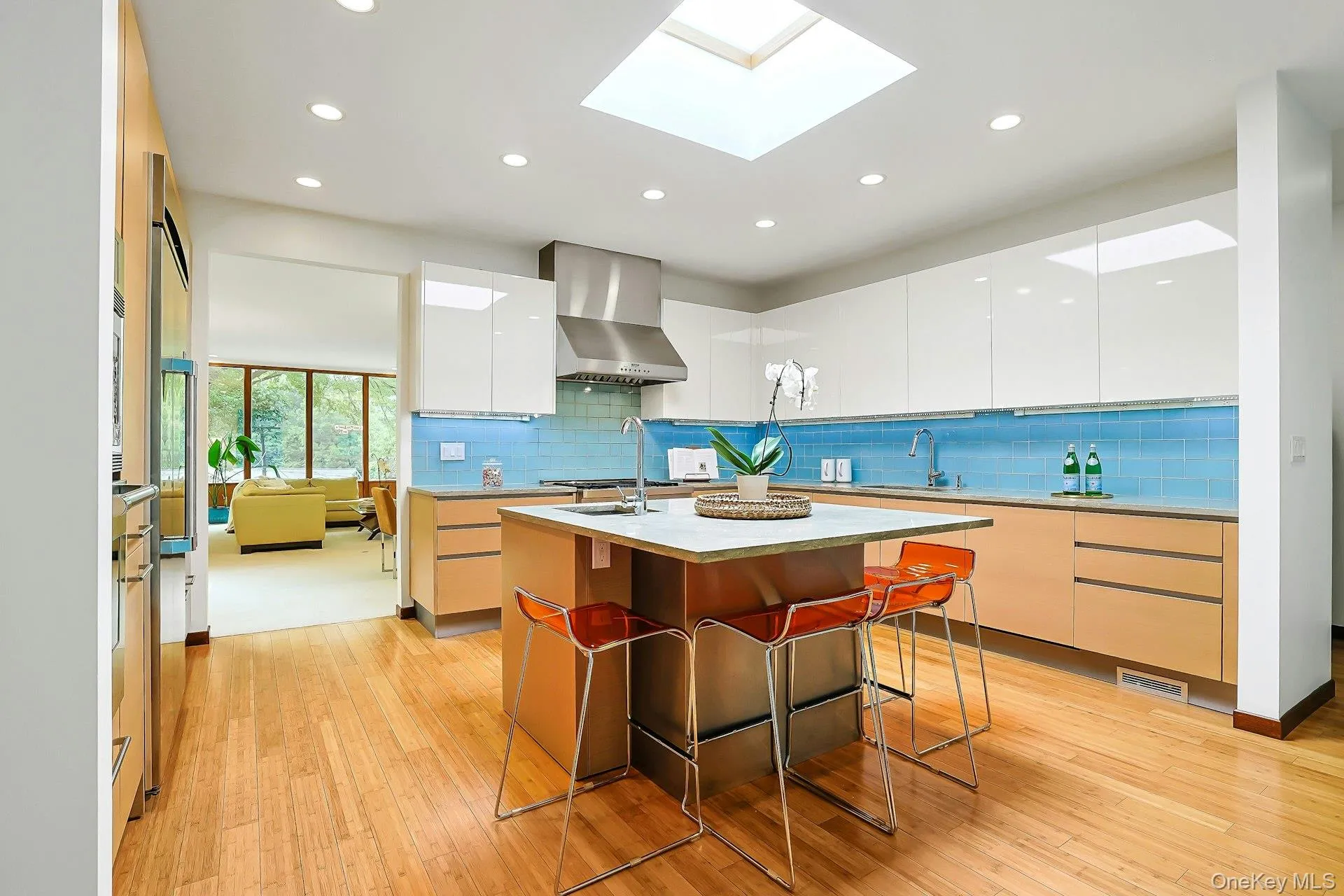 Flooded with natural light from the overhead skylight, this stunning kitchen blends clean modern lines with exceptional craftsmanship and everyday practicality. Flooded with natural light from the overhead skylight, this stunning kitchen blends clean modern lines with exceptional craftsmanship and everyday practicality.