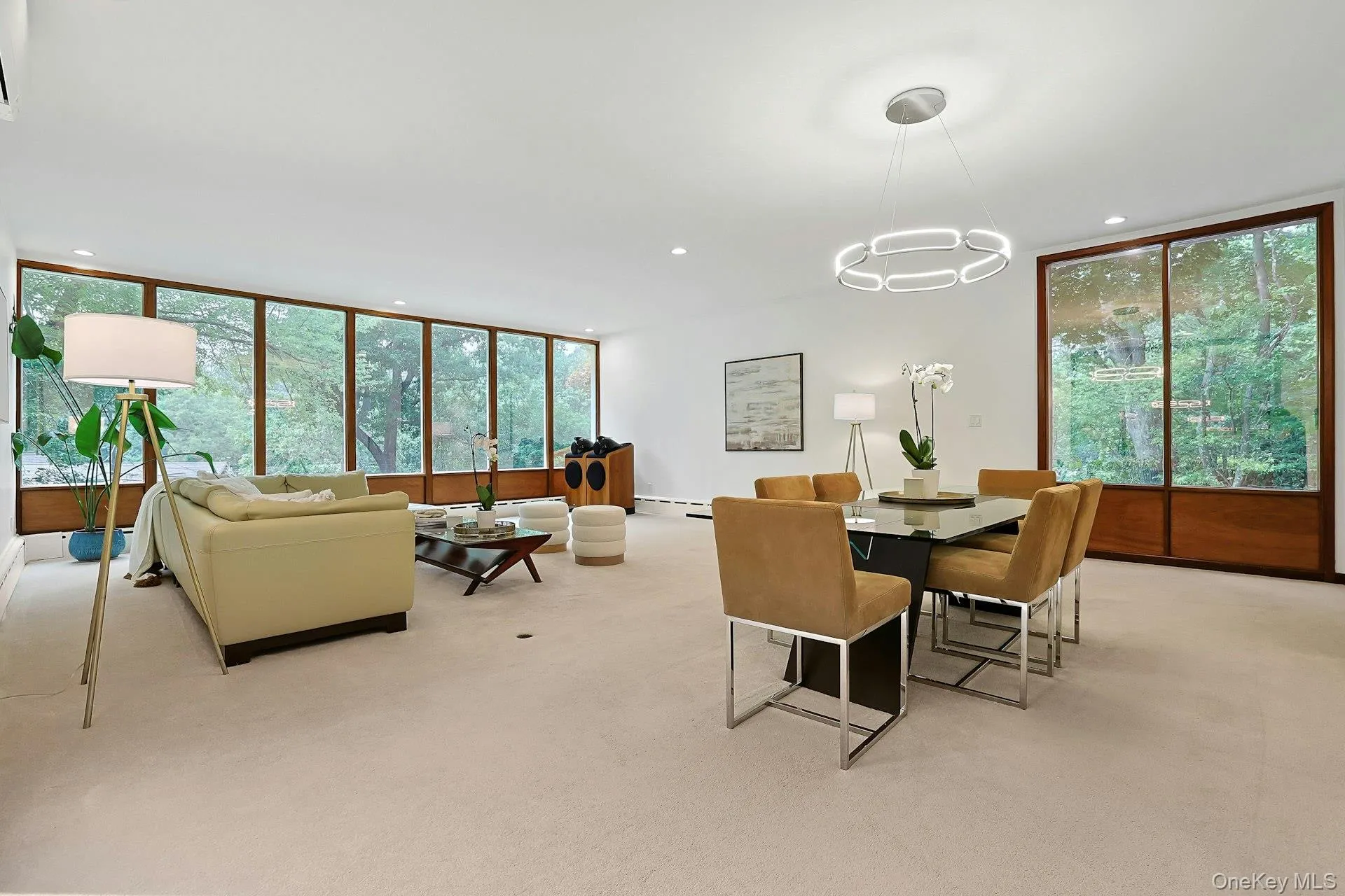 Designed for both entertaining and everyday living, the spacious great room celebrates classic Mid-Century Modern style with abundant natural light and warm mahogany accents. Designed for both entertaining and everyday living, the spacious great room celebrates classic Mid-Century Modern style with abundant natural light and warm mahogany accents.