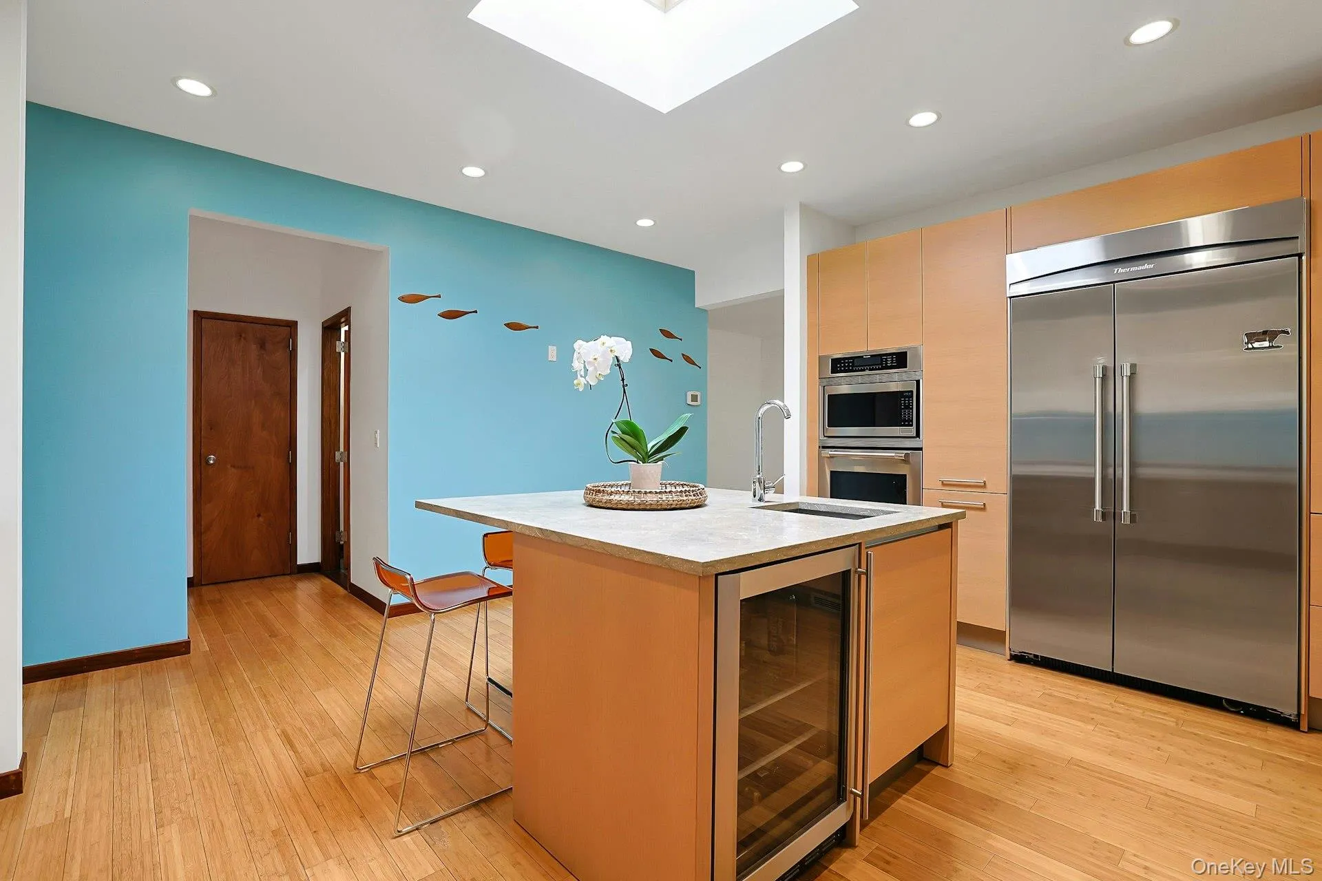 Custom cabinetry, limestone countertops, and high-end Thermador appliances create a kitchen that is both sophisticated and highly functional. Custom cabinetry, limestone countertops, and high-end Thermador appliances create a kitchen that is both sophisticated and highly functional.