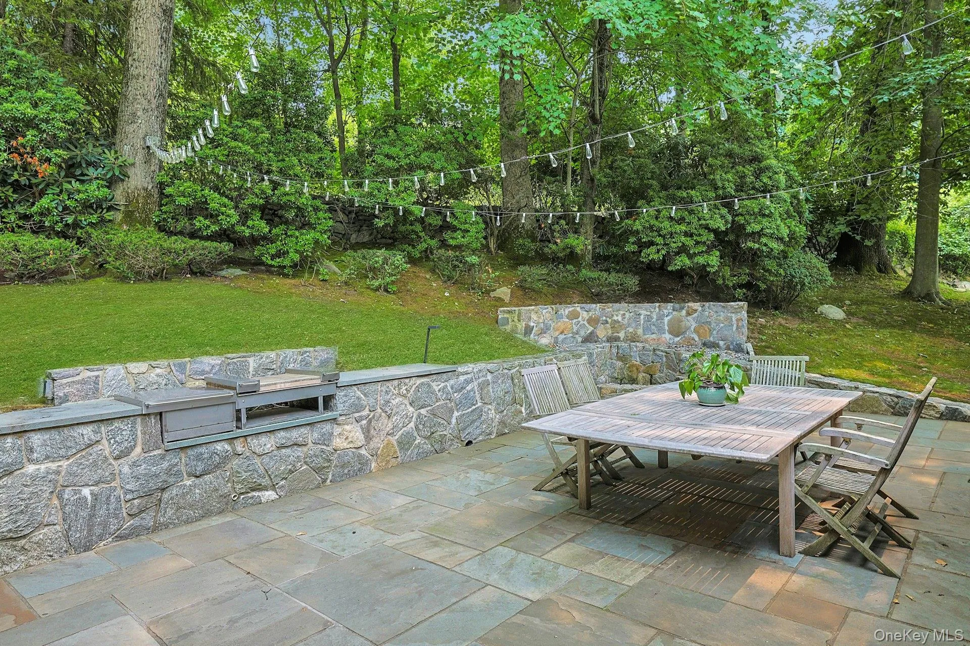 Gather around the built-in fire pit while enjoying the privacy of the professionally landscaped grounds and thoughtfully designed stonework. Gather around the built-in fire pit while enjoying the privacy of the professionally landscaped grounds and thoughtfully designed stonework.