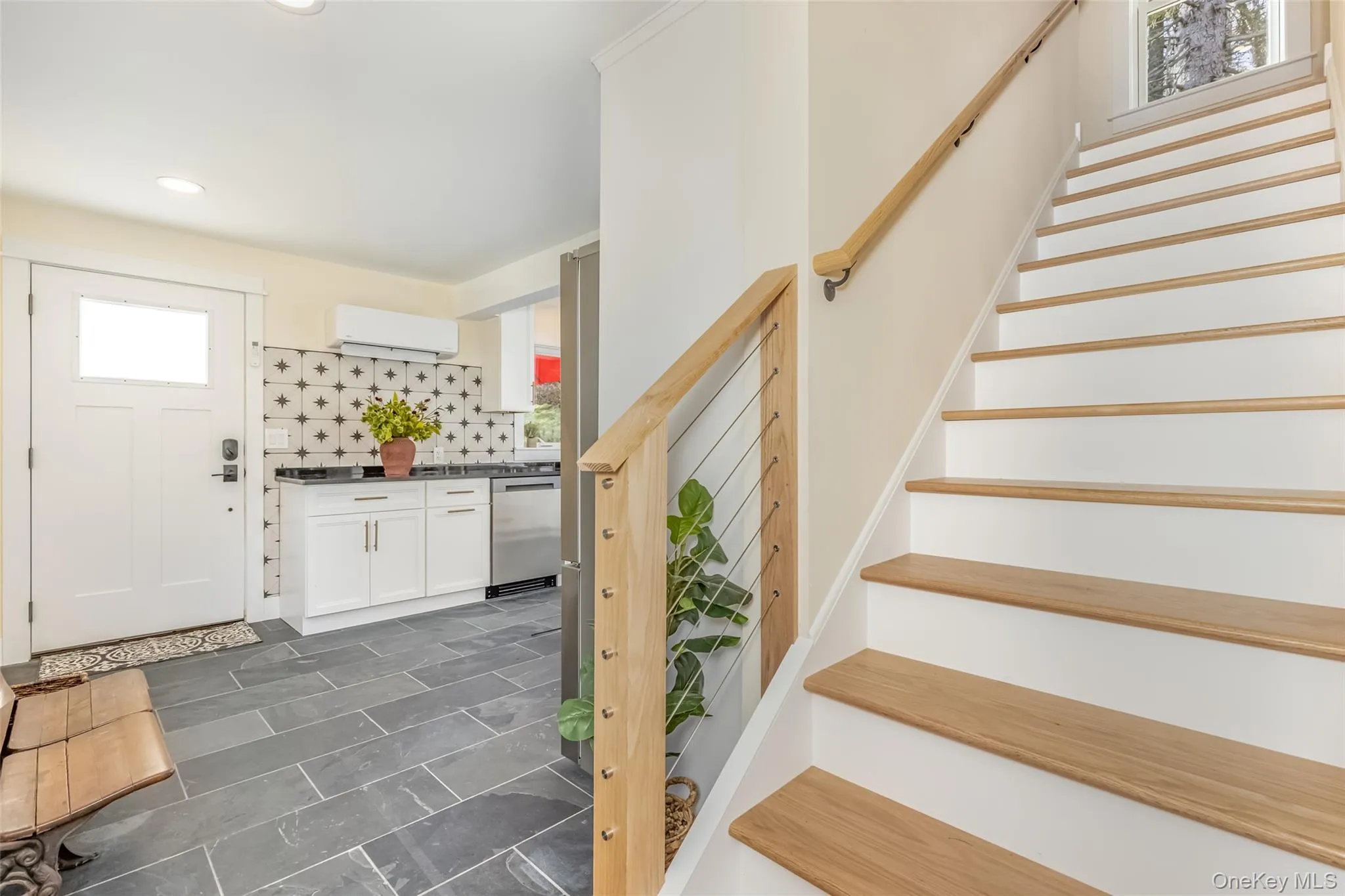 Foyer featuring a wall mounted air conditioner Foyer featuring a wall mounted air conditioner
