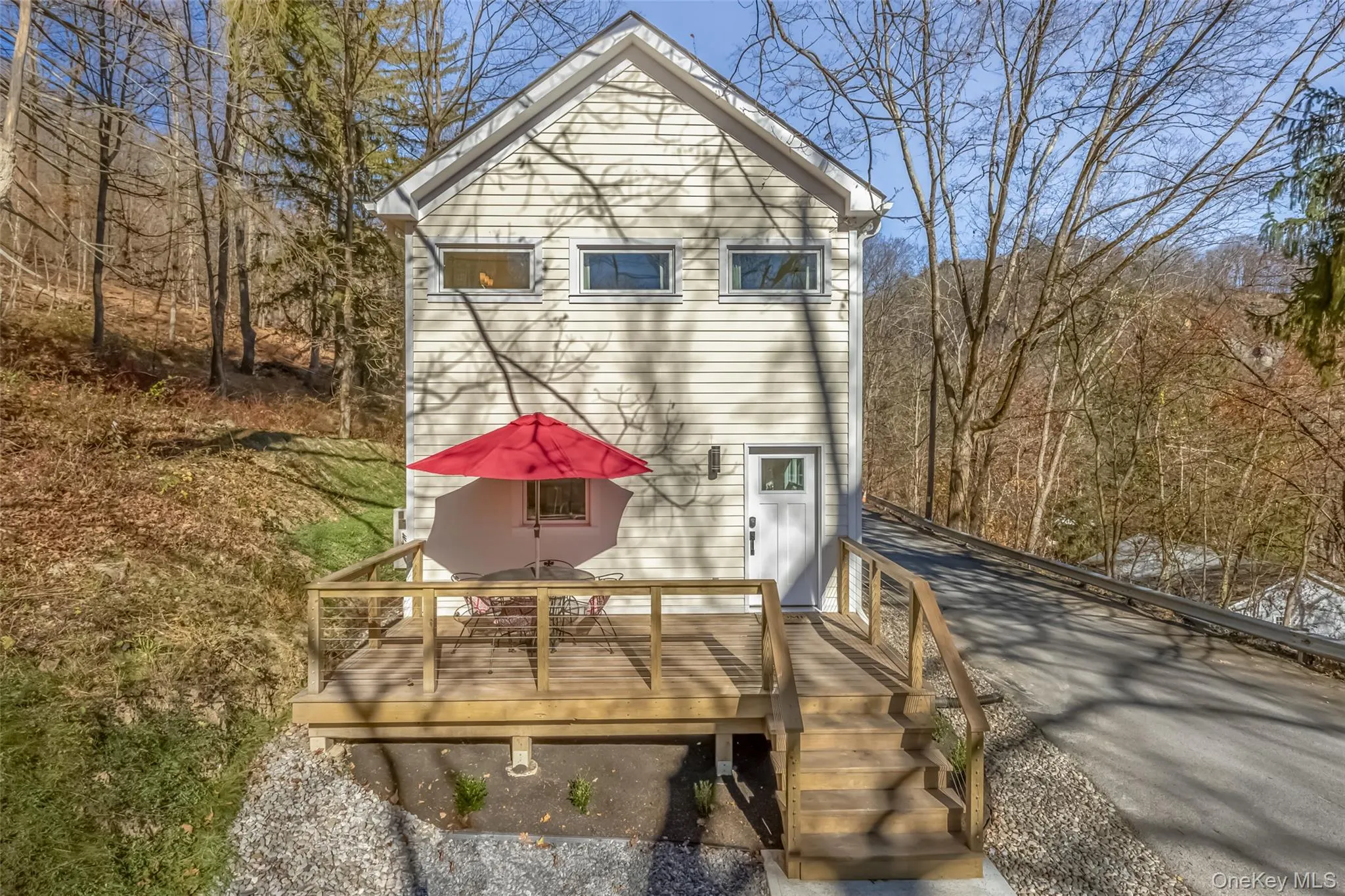 Rear view of house with a wooden deck Rear view of house with a wooden deck