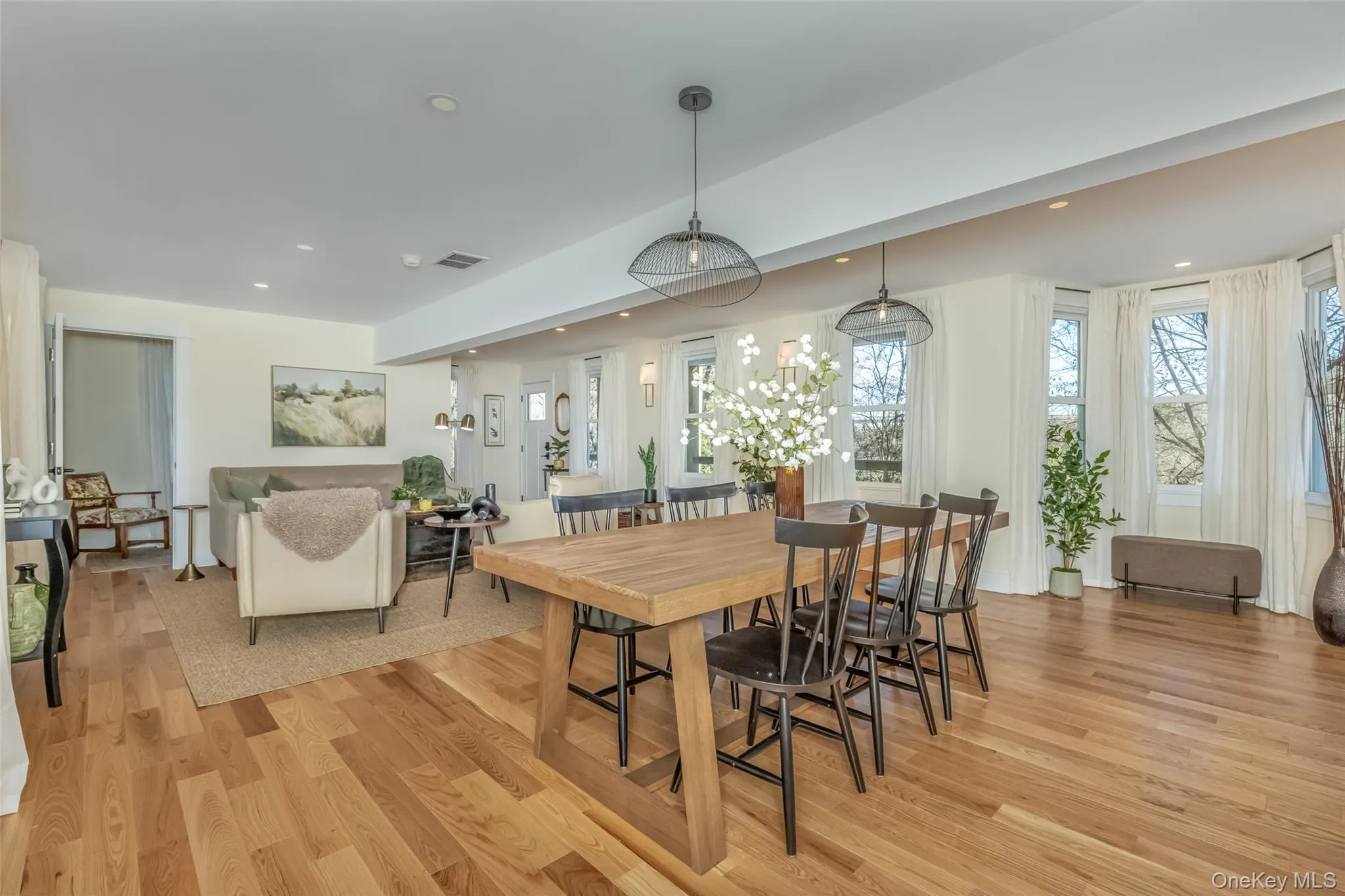 Dining area featuring light wood-type flooring Dining area featuring light wood-type flooring