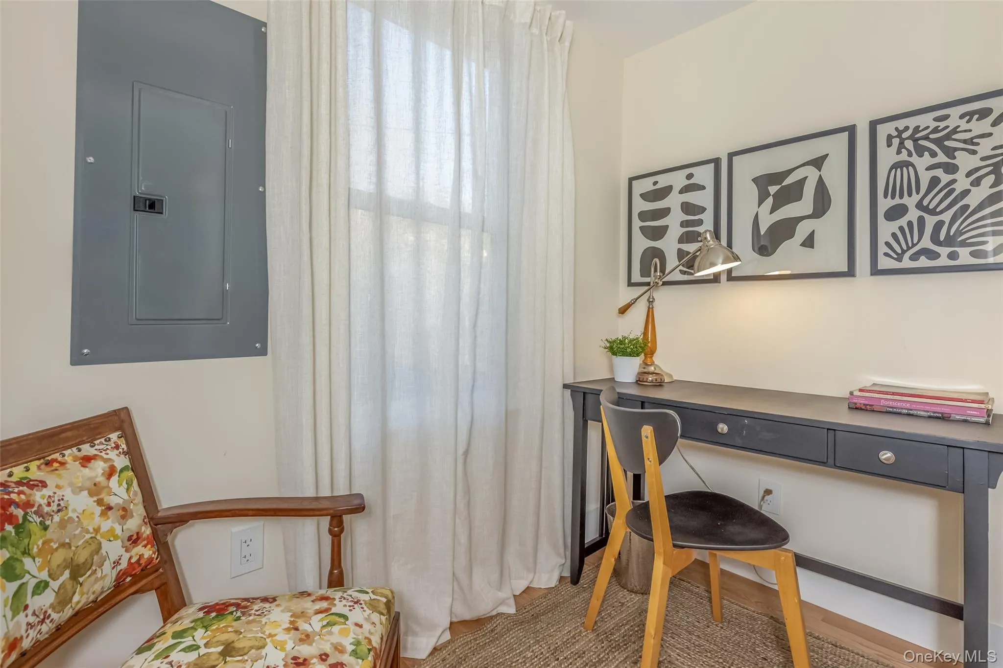 Carpeted home office with electric panel Carpeted home office with electric panel