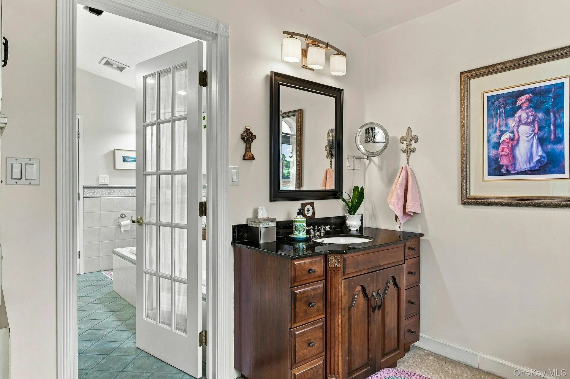 Separate sink and vanity outside the primary bathroom. Separate sink and vanity outside the primary bathroom.
