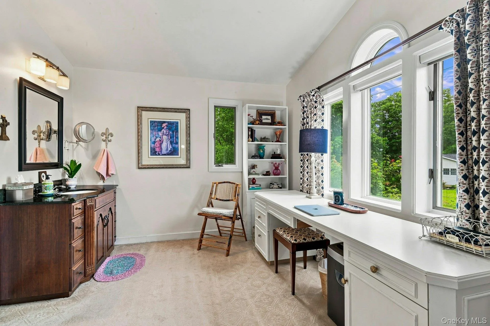 Charming area in primary bedroom complete with sink and desk off of the primary bath. Charming area in primary bedroom complete with sink and desk off of the primary bath.