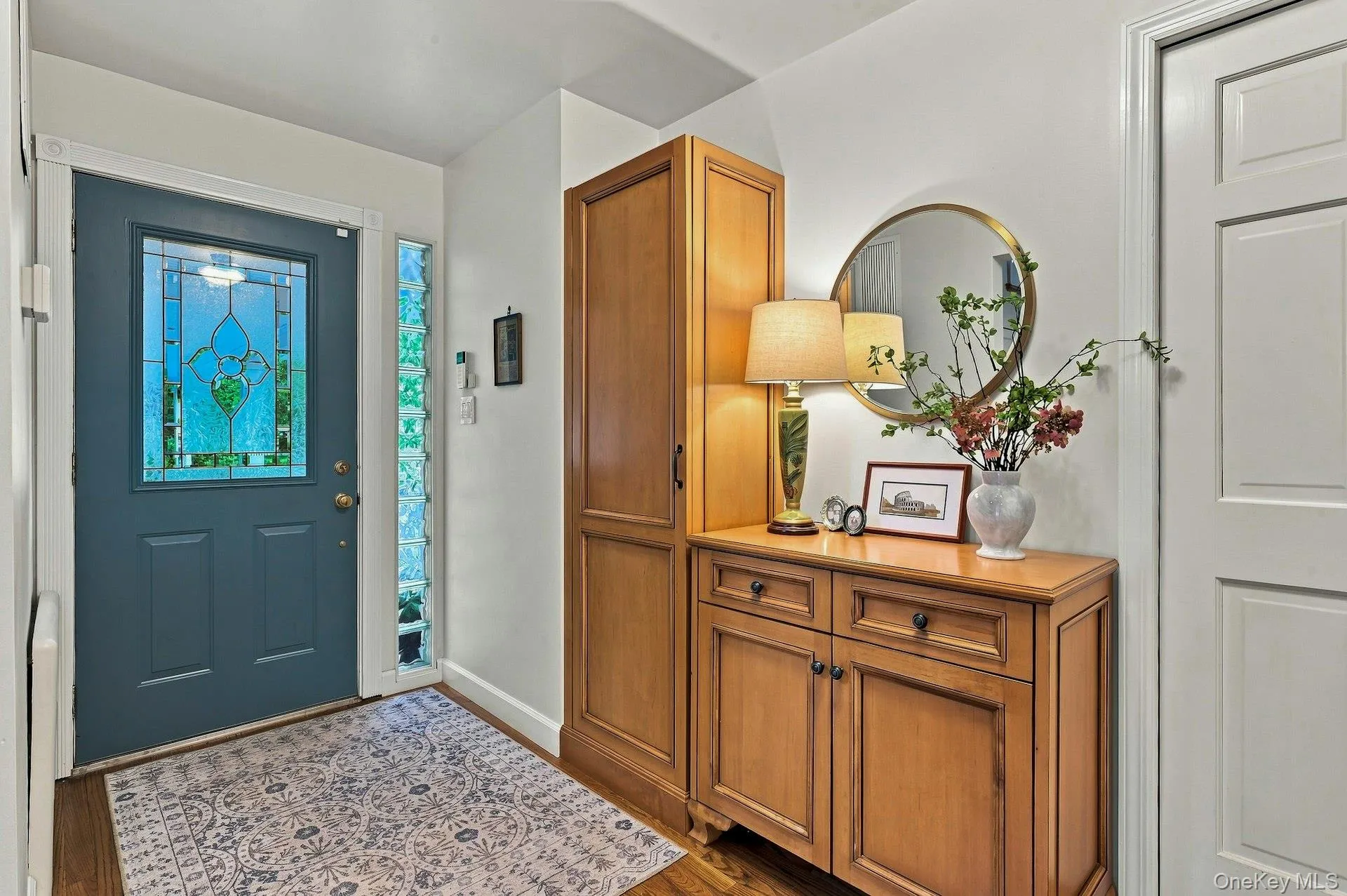 Front entry with hardwood flooring Front entry with hardwood flooring