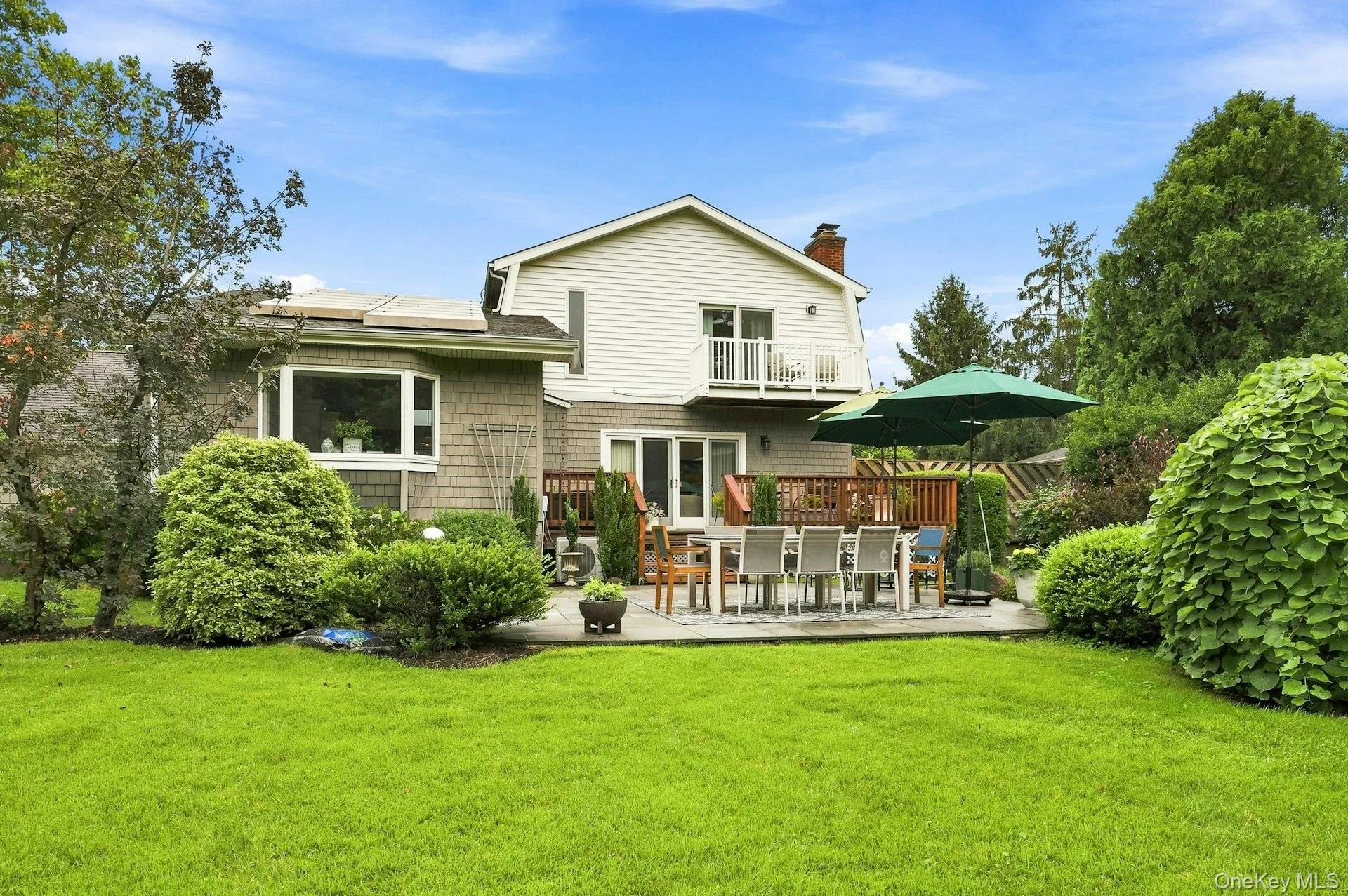 Half acre plus flat private yard looking at back of home. Half acre plus flat private yard looking at back of home.