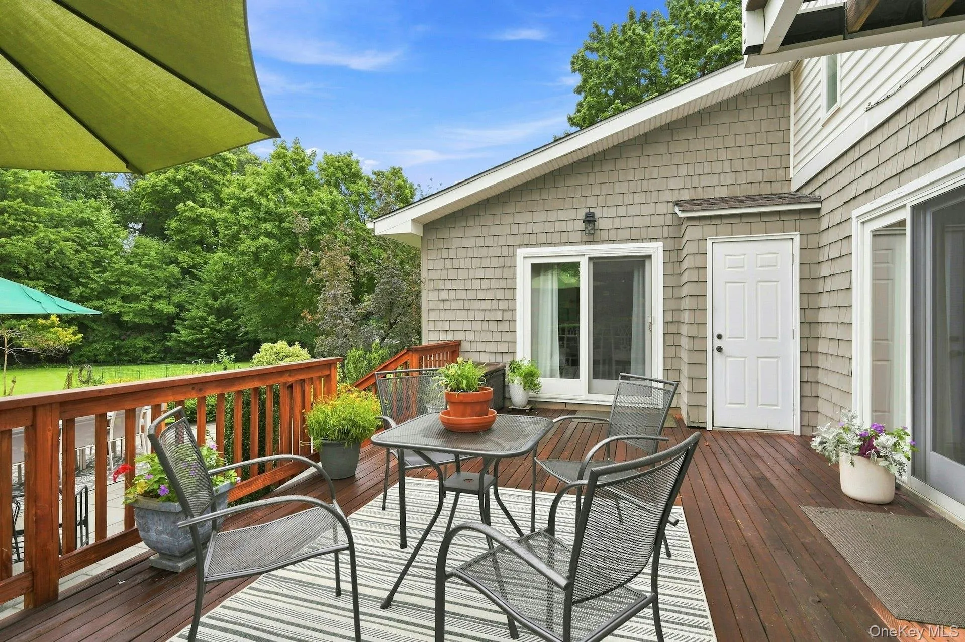 redwood with doors leading from dining area to block patio redwood with doors leading from dining area to block patio