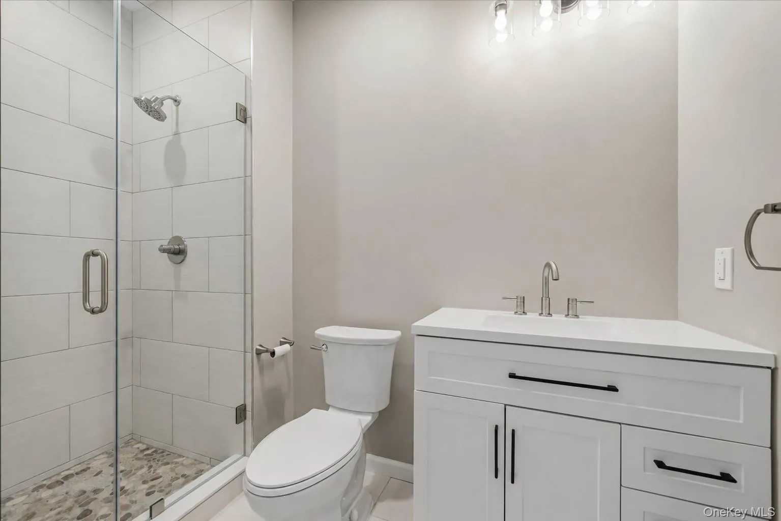 Full bath with glass enclosure and ceramic tile. Full bath with glass enclosure and ceramic tile.