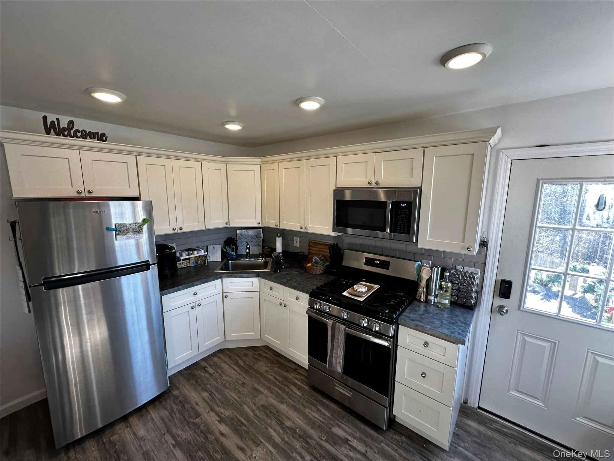 Kitchen featuring a full suite of stainless steel appliances including a refrigerator, range, and built-in microwave Kitchen featuring a full suite of stainless steel appliances including a refrigerator, range, and built-in microwave