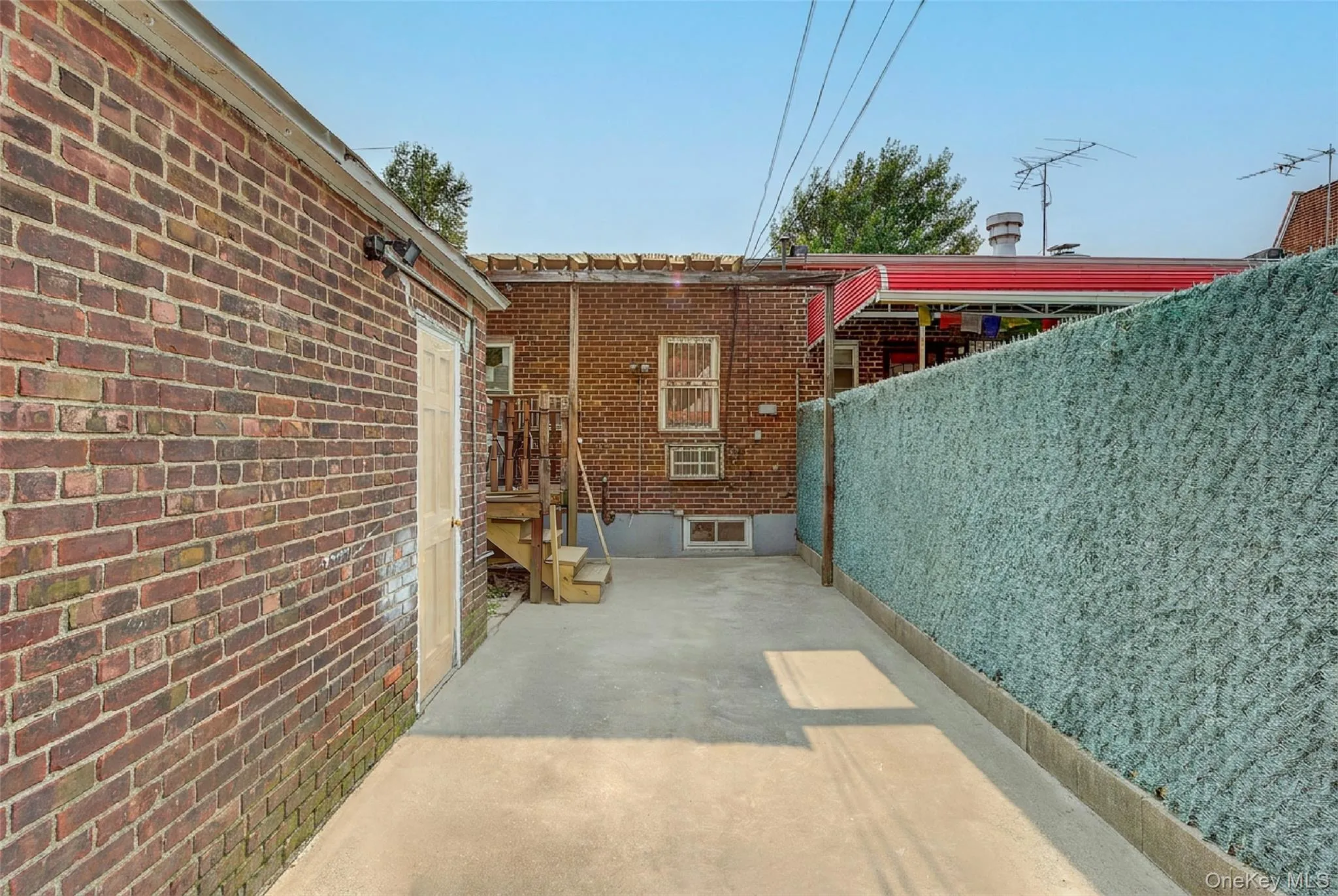 backyard space/ entrance to garage backyard space/ entrance to garage