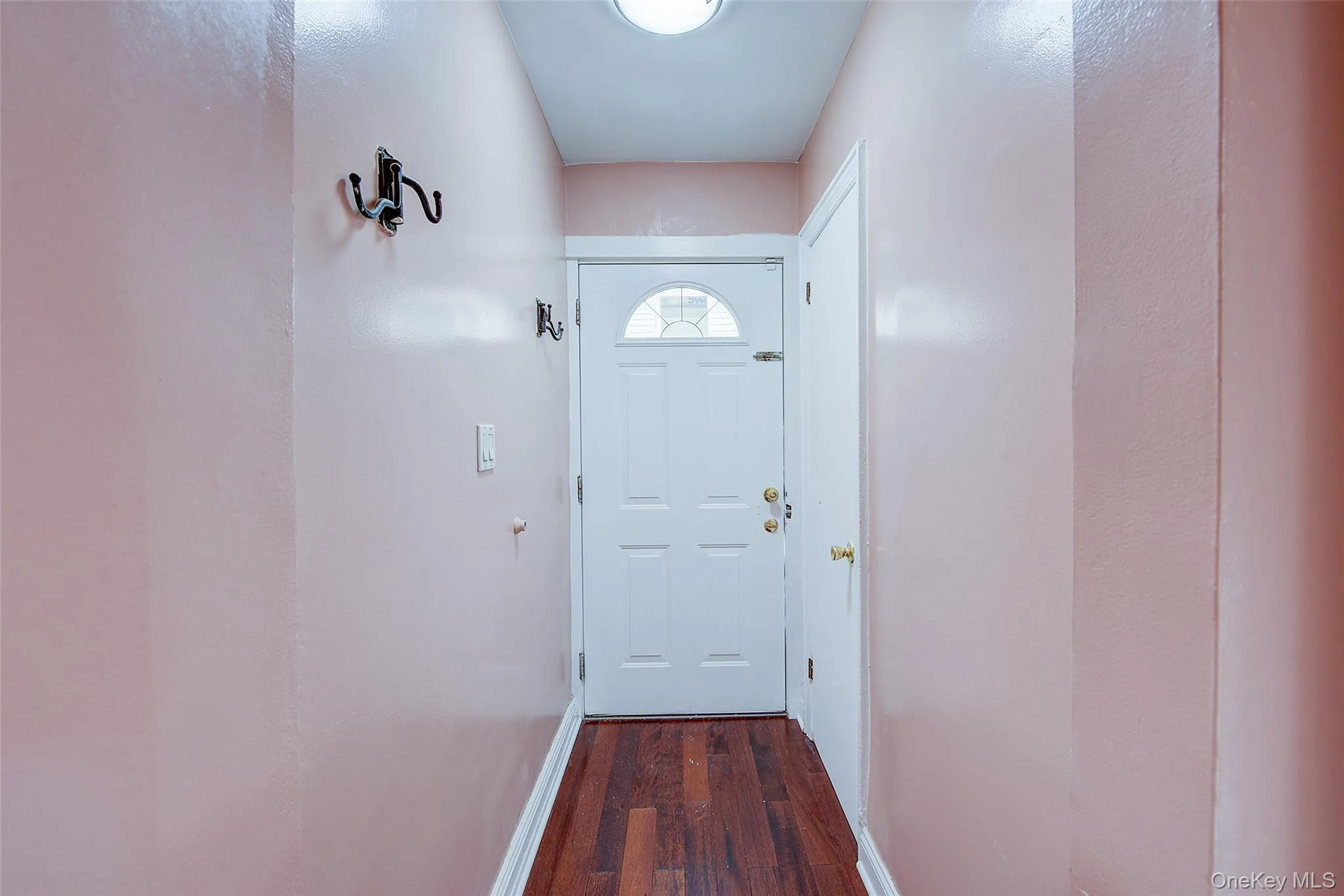 Front door, adjacent to it is a closet Front door, adjacent to it is a closet