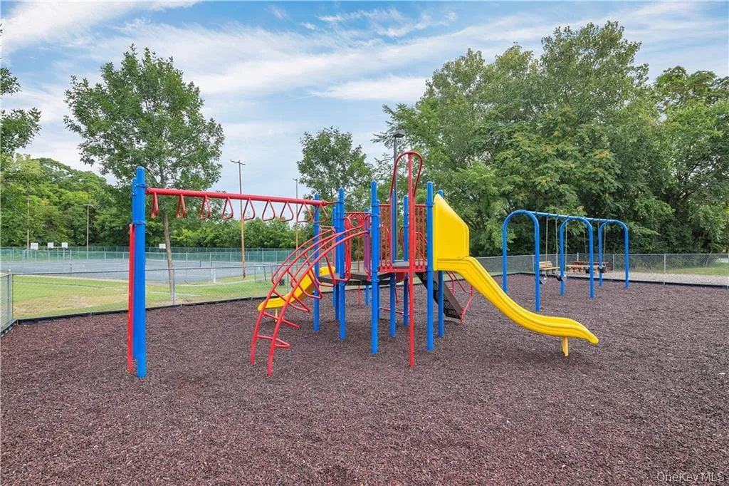 Adjacent to the pool is a soft ground playground. Adjacent to the pool is a soft ground playground.