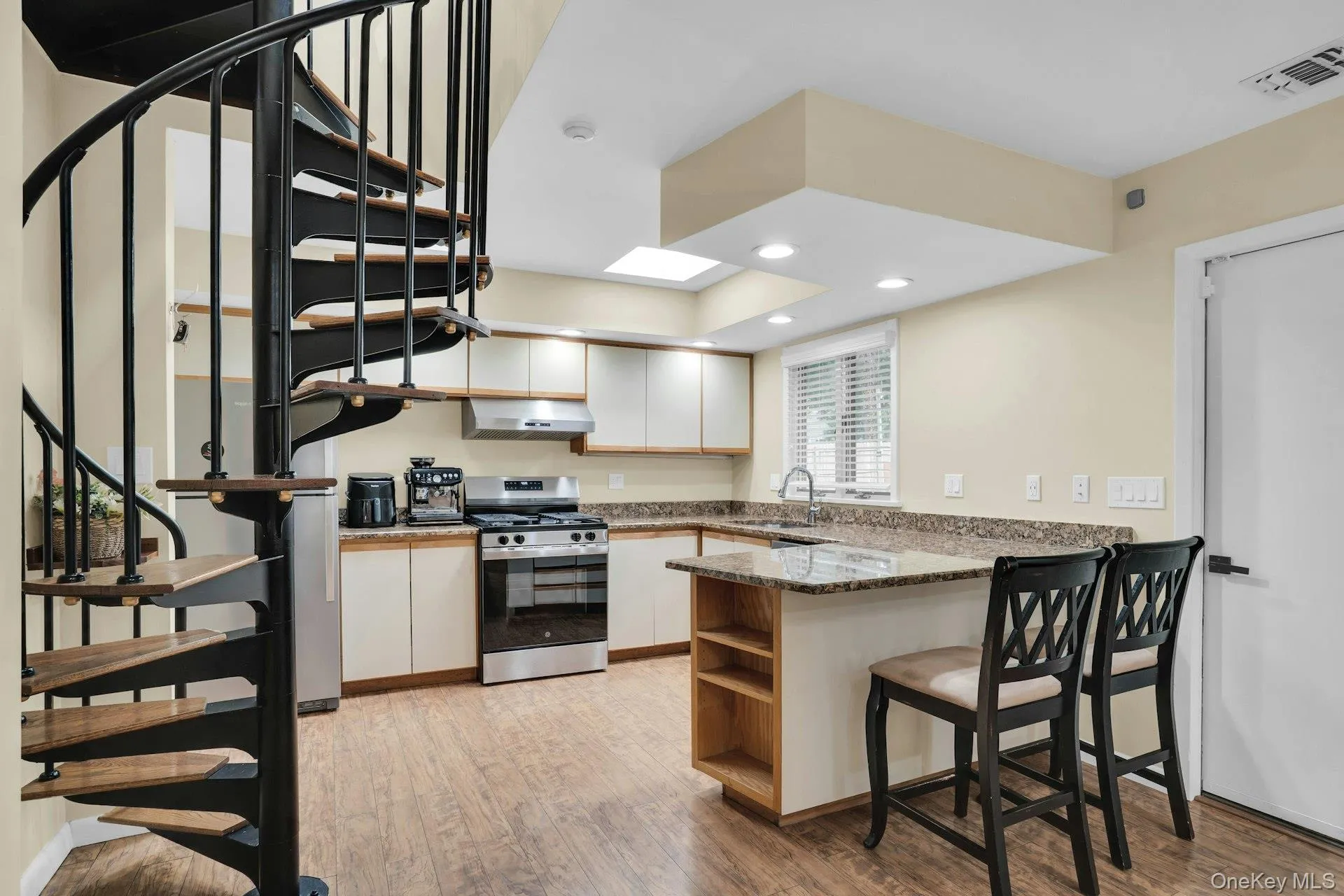 Spiral staircase leads to office or small bedroom. Spiral staircase leads to office or small bedroom.