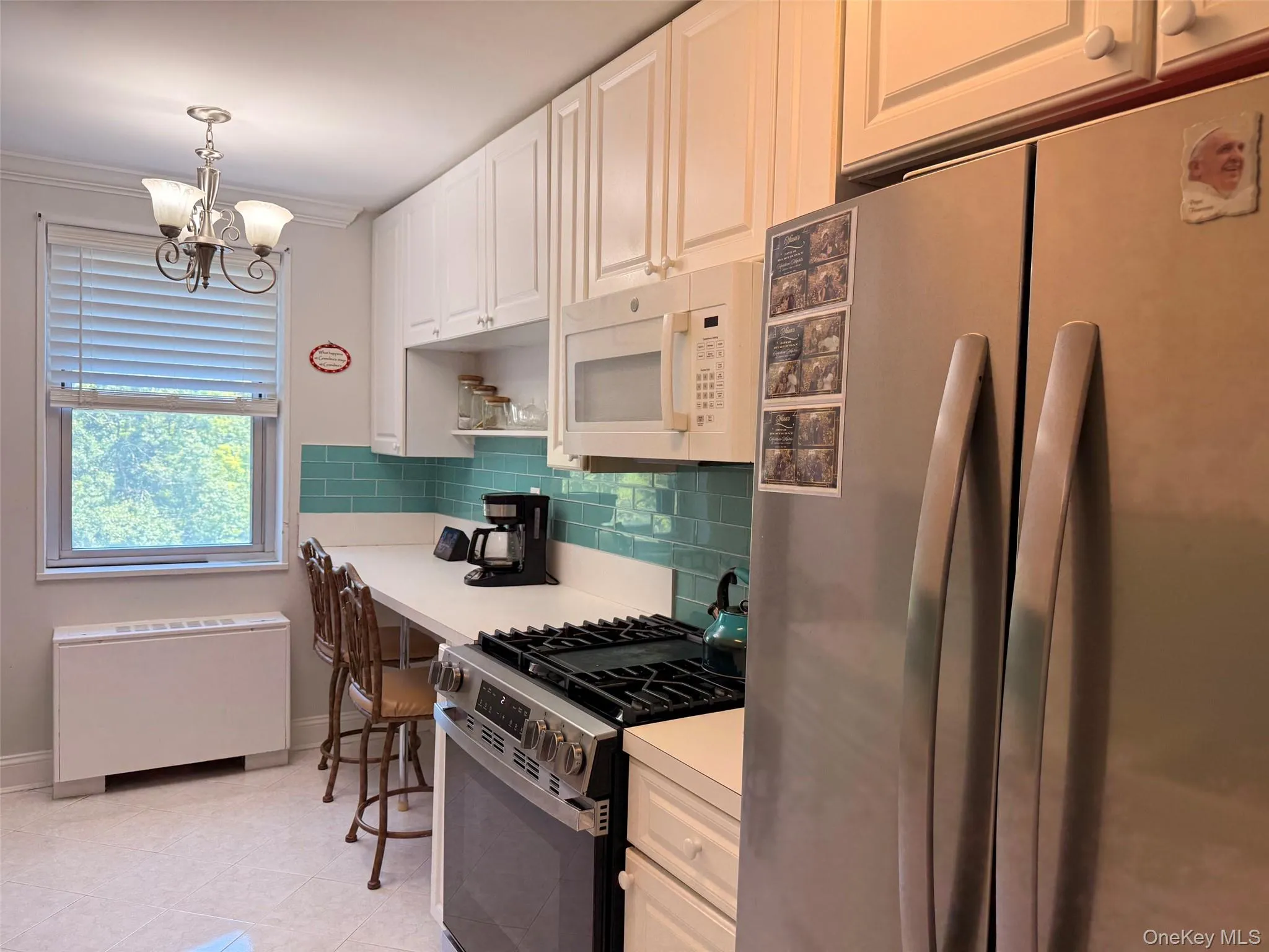New refrigerator and glass backsplash New refrigerator and glass backsplash