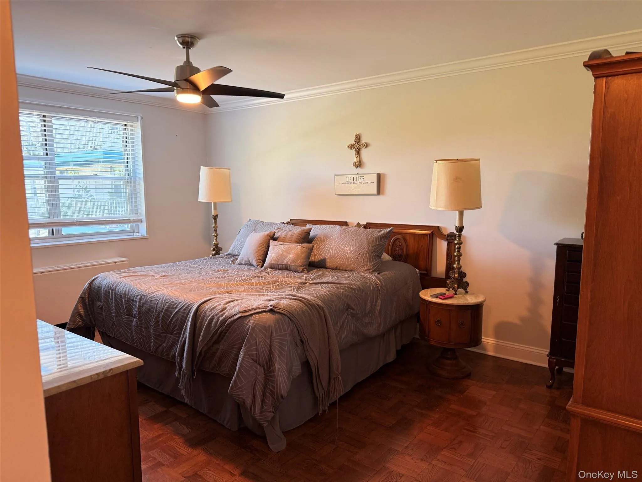 with ceiling fan and walk-in closet with ceiling fan and walk-in closet