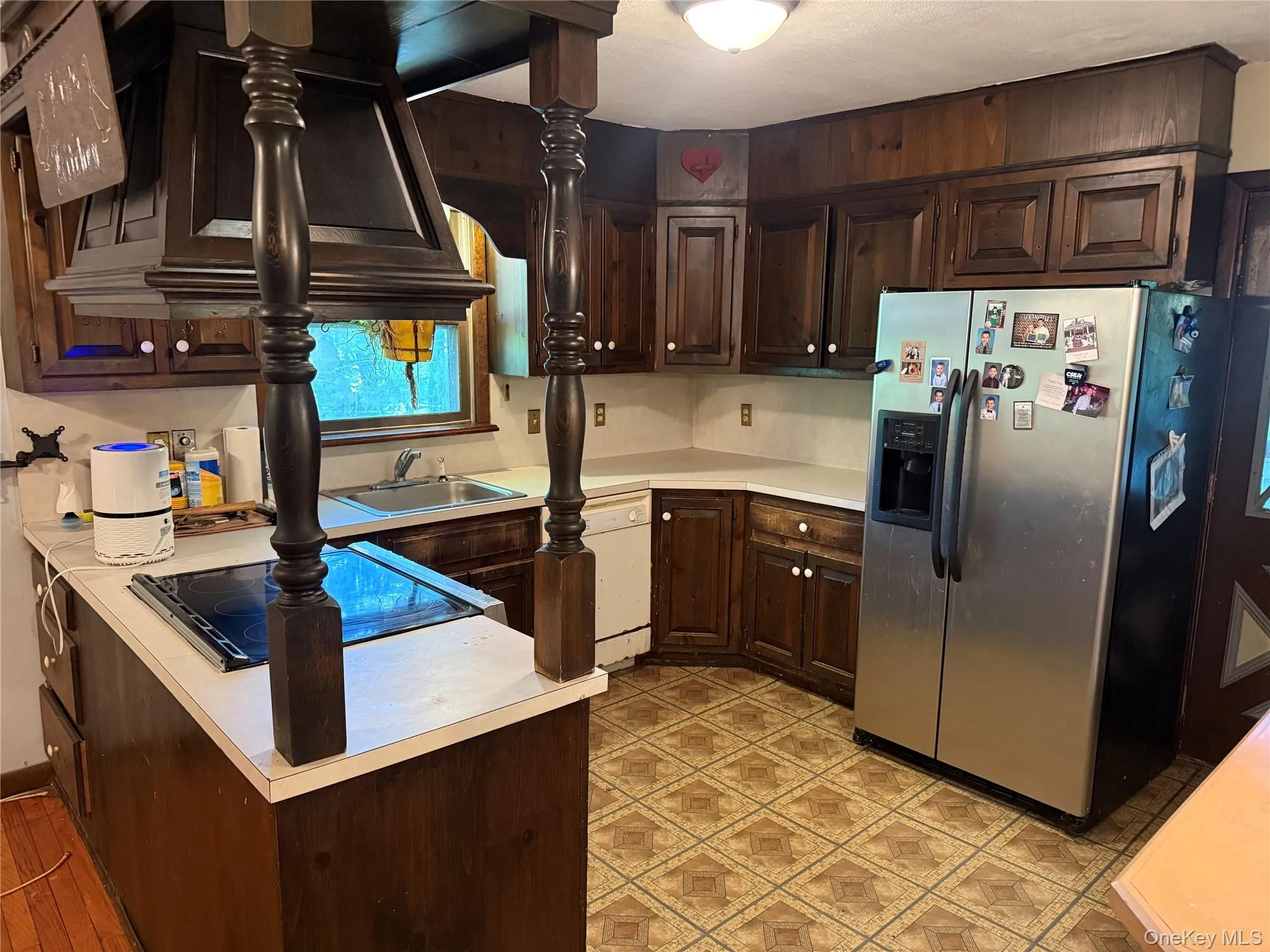Kitchen with access to a side deck. Kitchen with access to a side deck.