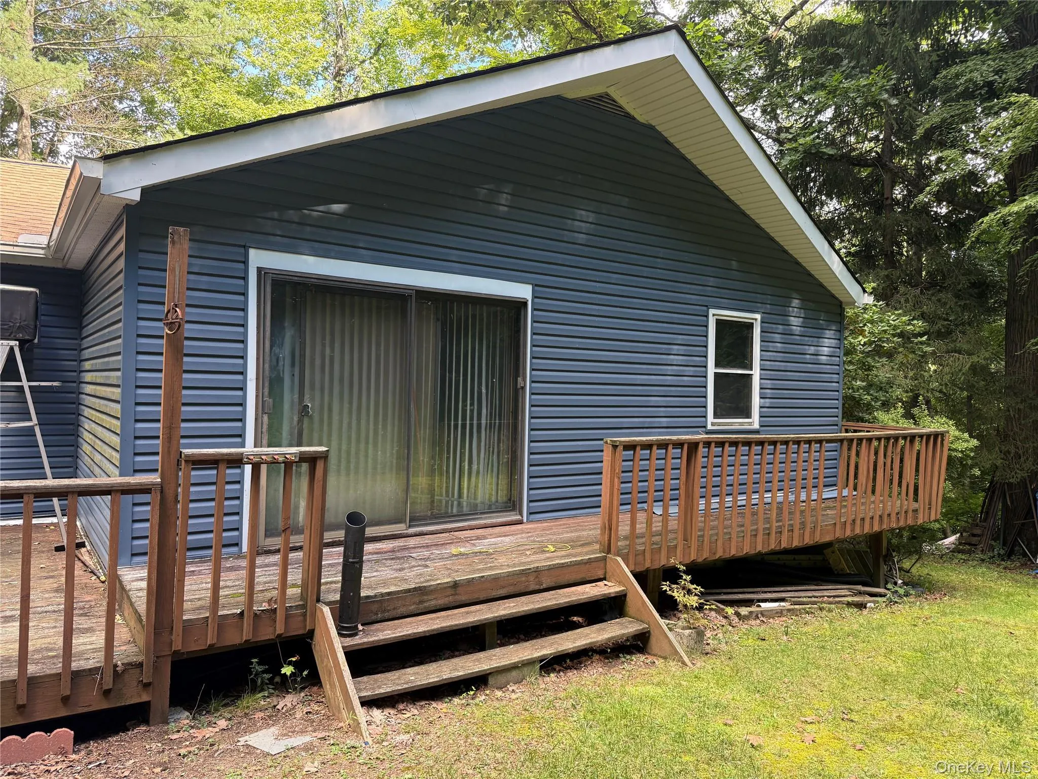 Back deck with access from the primary bedroom. Back deck with access from the primary bedroom.