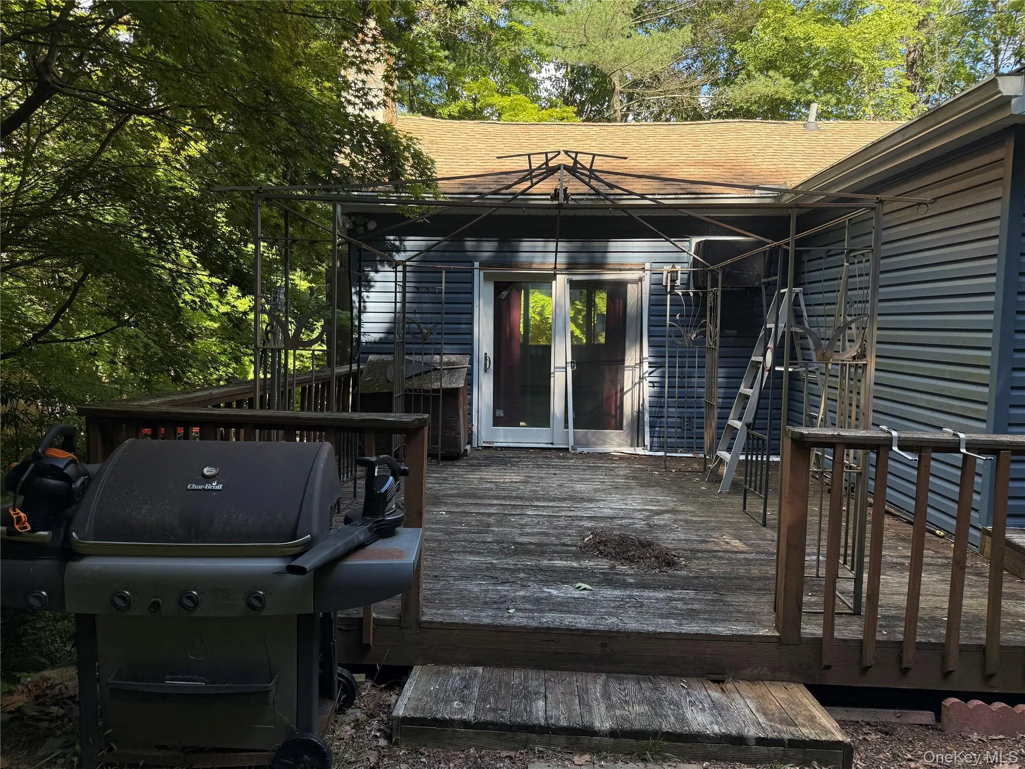 Back deck, with access from the living room that wraps around the entire back of the house. Back deck, with access from the living room that wraps around the entire back of the house.