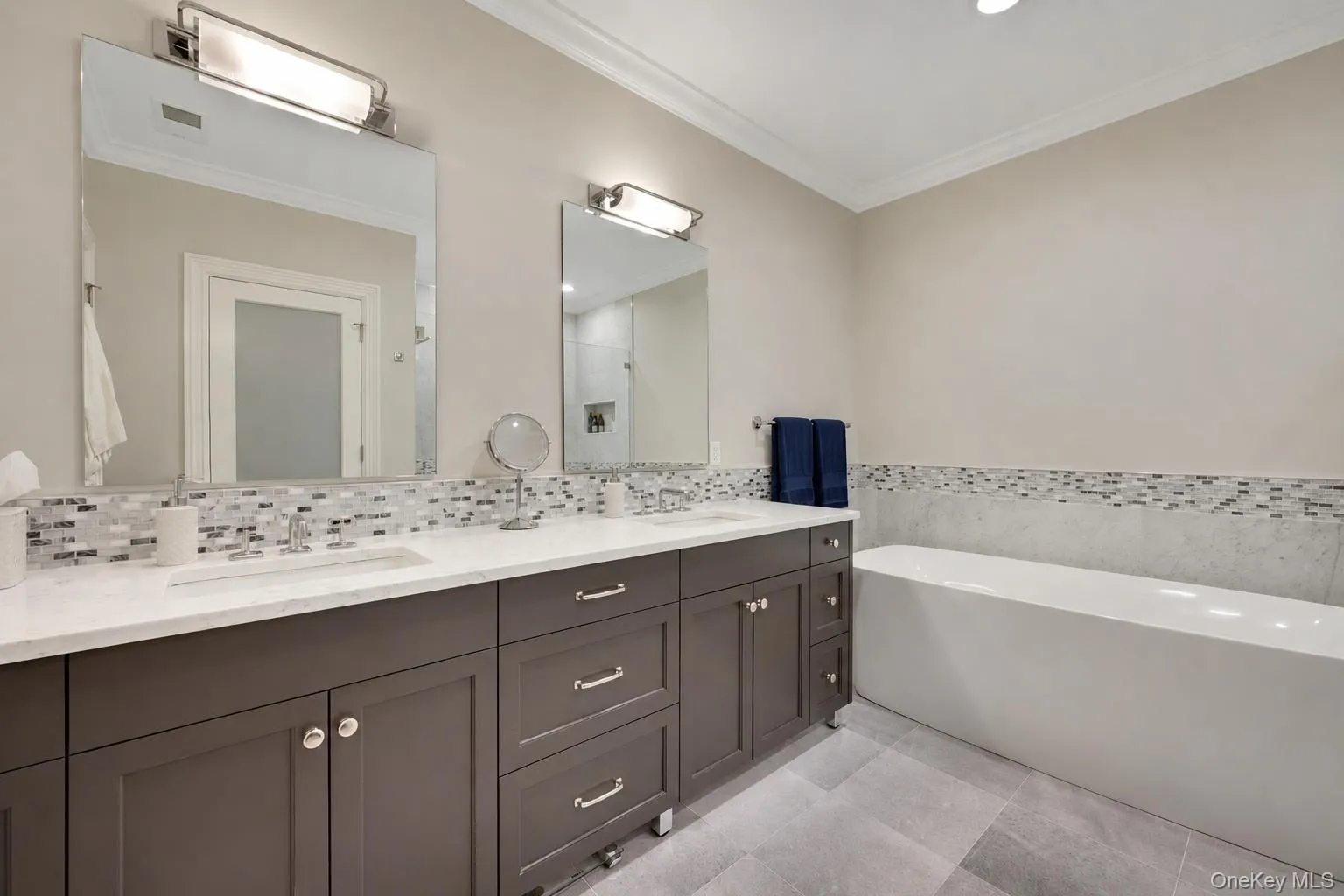 Double marble vanity, Waterworks fixtures and standalone soaking tub Double marble vanity, Waterworks fixtures and standalone soaking tub