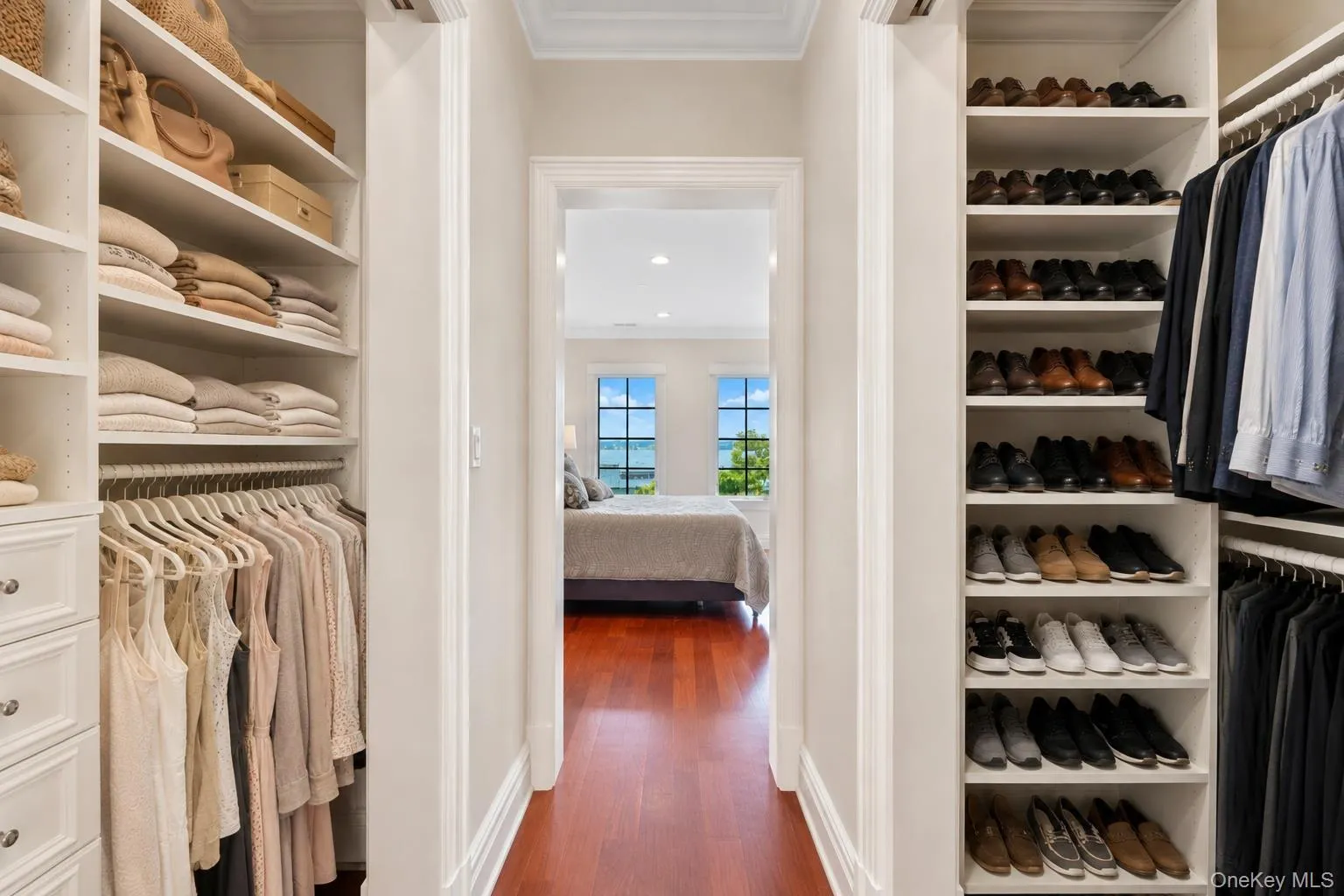 Large closets with pocket doors, custom cabinetry and shelving Large closets with pocket doors, custom cabinetry and shelving