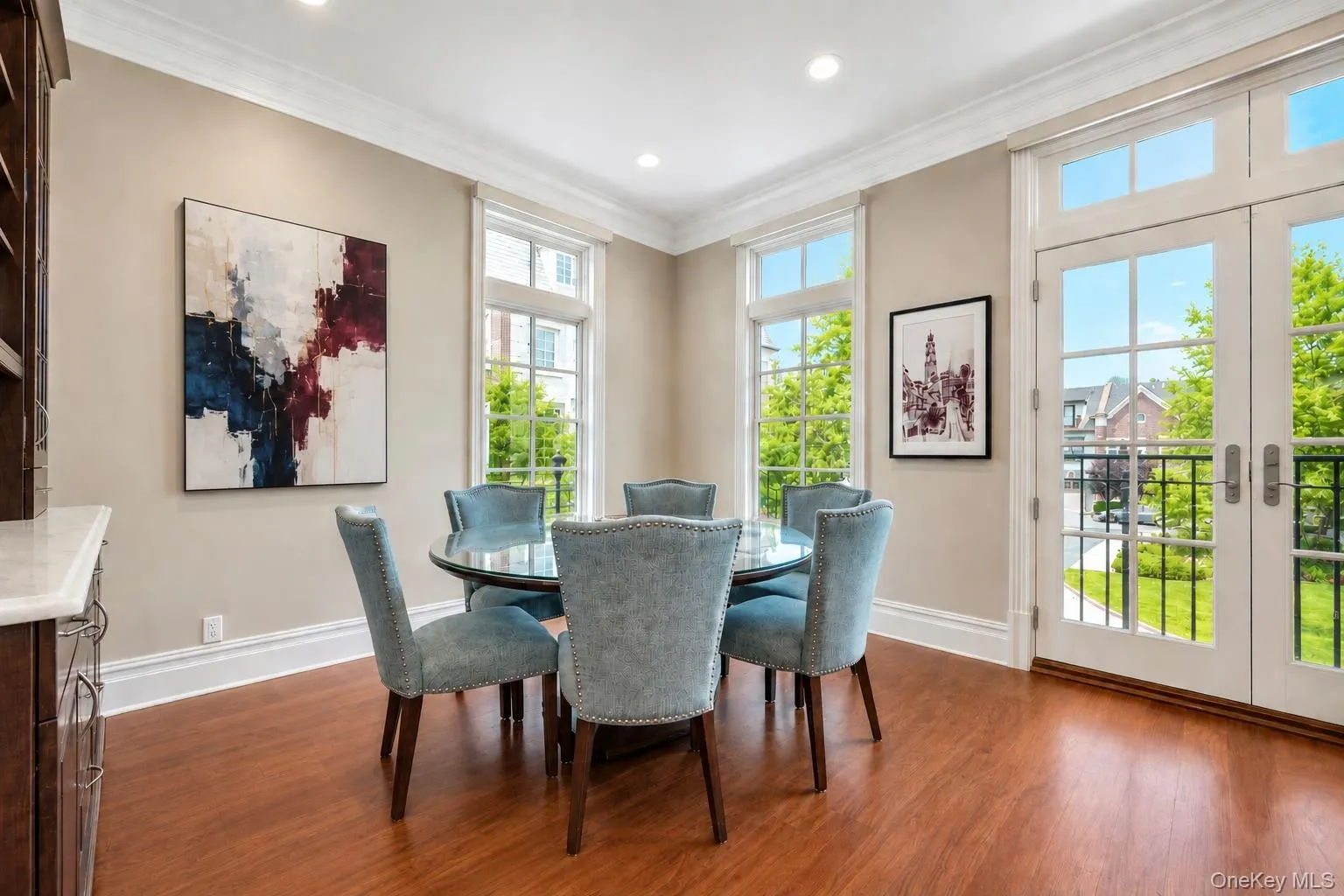 Enjoys oversized windows, Juliet balcony with built in custom cabinetry Enjoys oversized windows, Juliet balcony with built in custom cabinetry