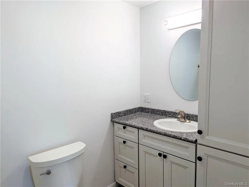 Full bathroom with storage for linens/essentials Full bathroom with storage for linens/essentials