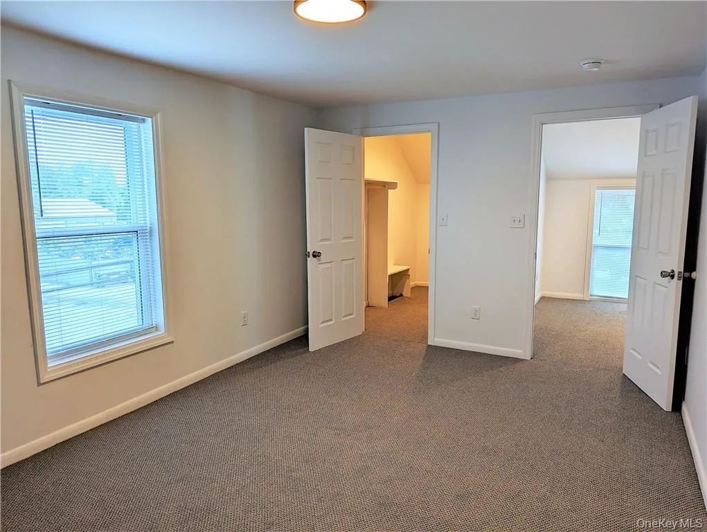 Bedroom with walk-in closet and heat/air pump Bedroom with walk-in closet and heat/air pump